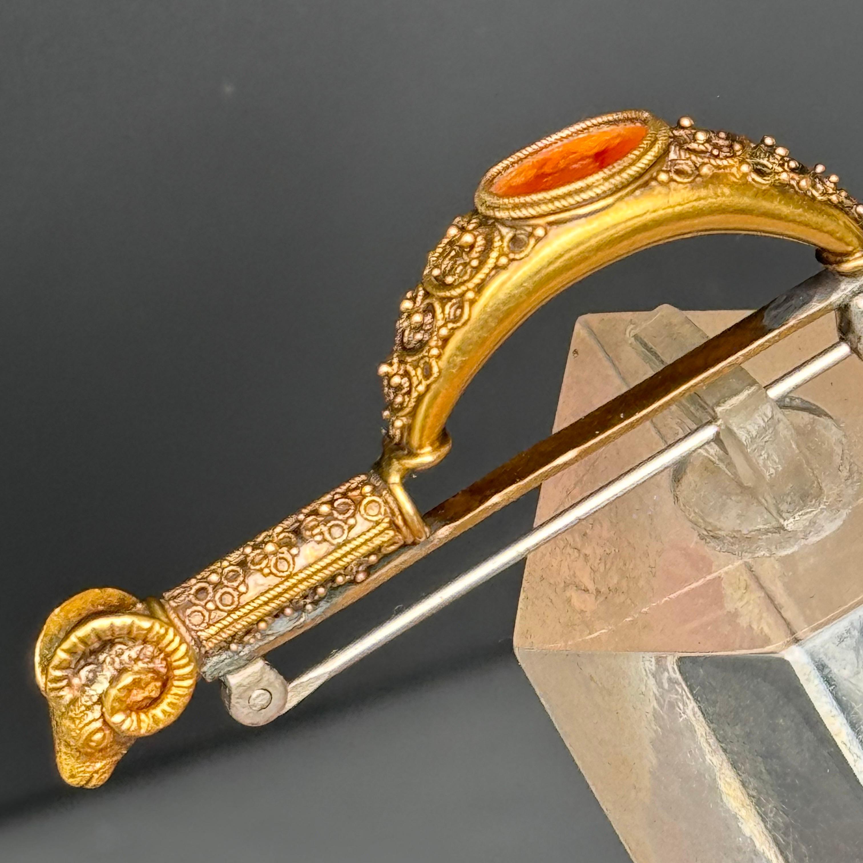 18kt gold Carnelian Cameo Archaeological Revival Fibula Brooch In Fair Condition For Sale In Plainsboro, NJ