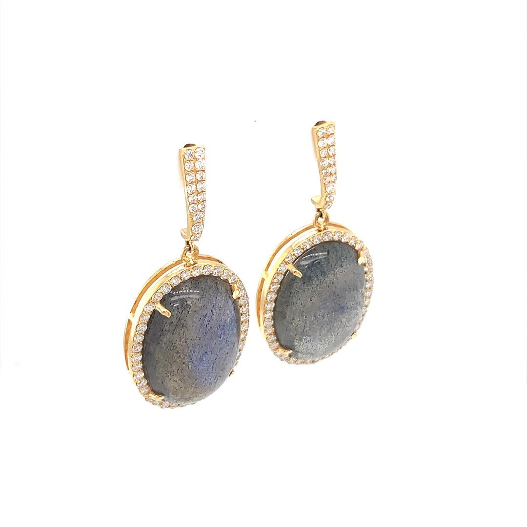 A stunning set of dangle earrings in 18 carat yellow gold set with a 0.95 carat diamond and a natural 19.47 carat labradorite. 