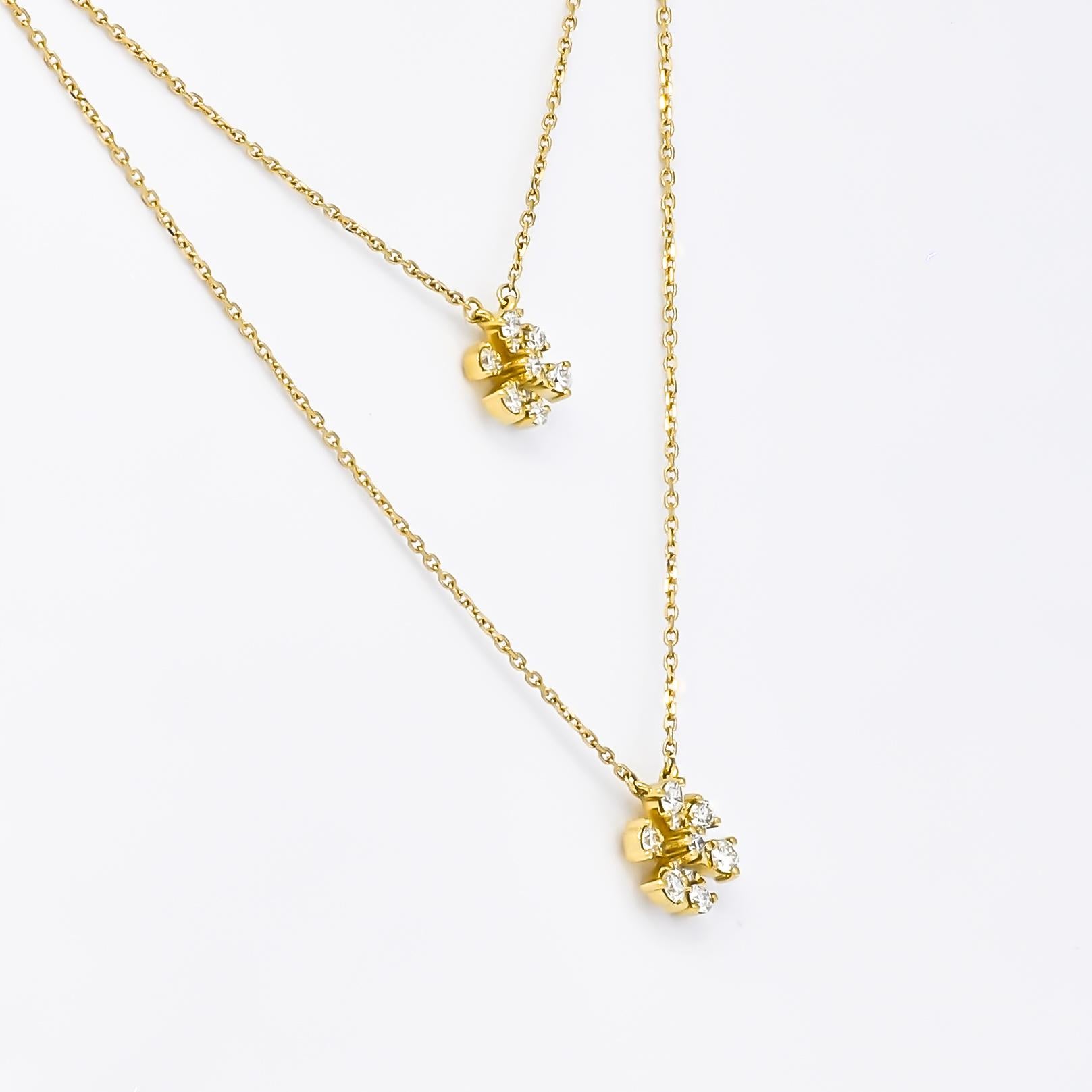 The necklace features a double-layer chain design that adds depth and dimension to its overall aesthetic. Each layer gracefully cascades along the neckline, creating a captivating visual effect that draws attention. The delicate chains are