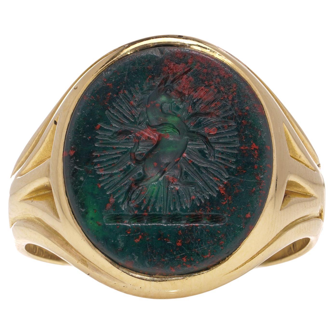  18kt. gold intaglio bloodstone signet ring, featuring a rampant unicorn