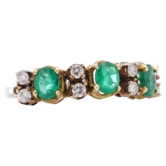 18 Karat Gold Ladies Ring with 1.20 Carats Oval Emeralds and Diamonds