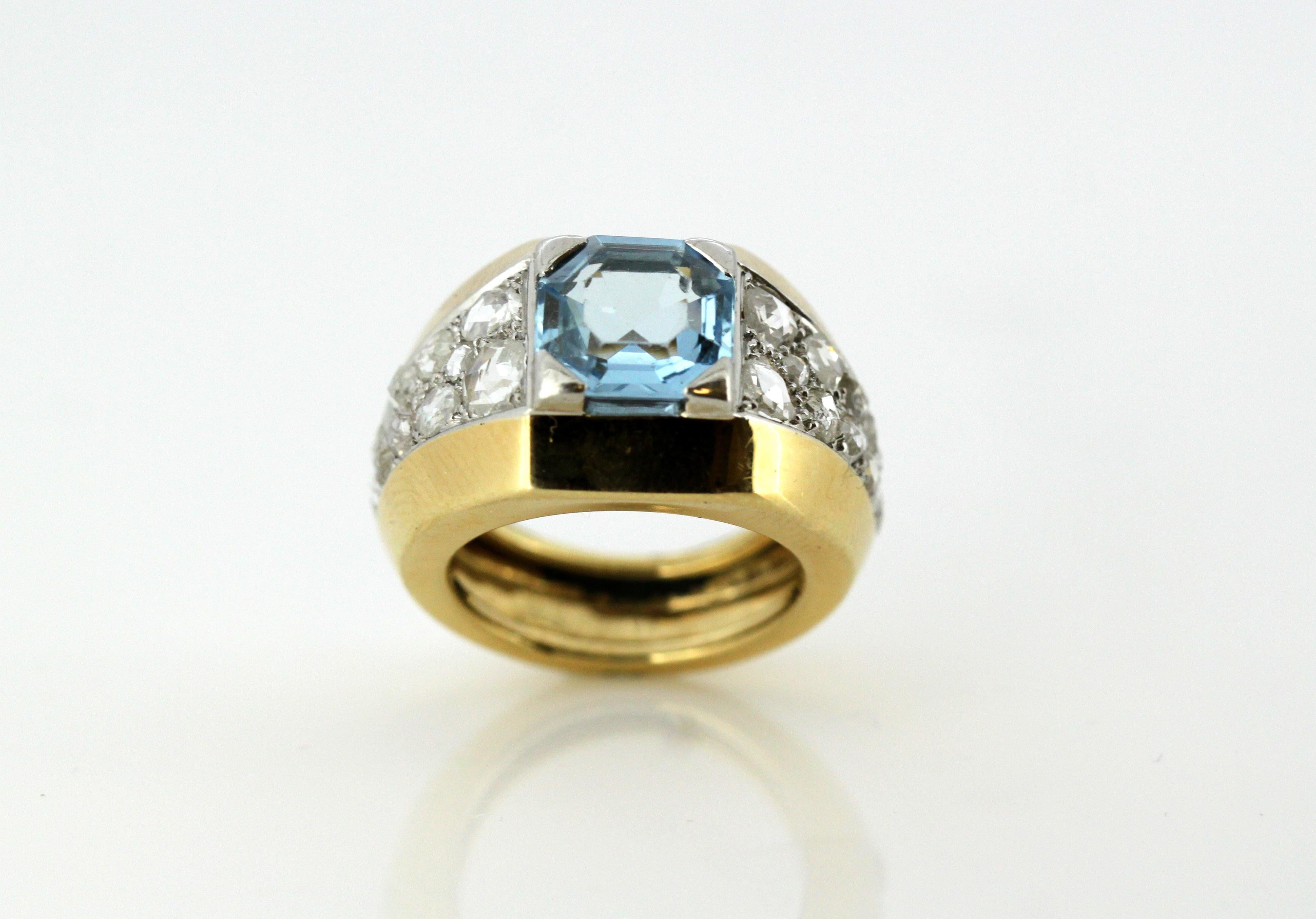18kt yellow gold ladies ring with natural aquamarine and rose cut diamonds.
Hallmark on outer ring band is worn off.
Circa 1940's

Dimensions -
Finger Size : (UK) = I (US) = 4 3/4 (EU) = 47 3/4
Size : 2.5 x 2.3 x 1.4 cm
Weight: 10 grams