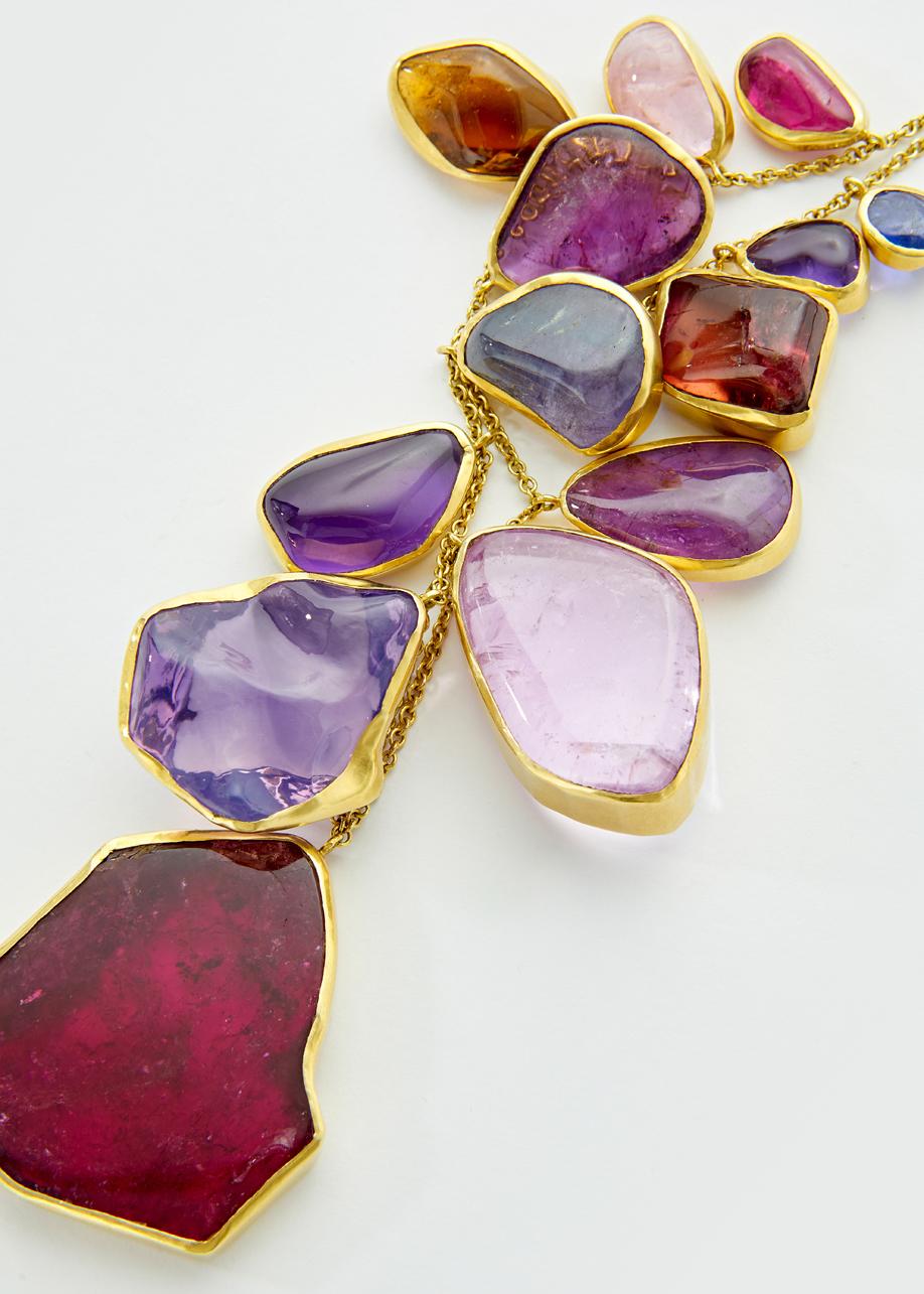 A one-of-a-kind necklace, thirteen hand-cut gems gathered from around the world prized for their size and colours. A palate of the sunset with pink tourmalines and rose quartz, lilac kunzite and burnt orange tourmalines frame the neck with these