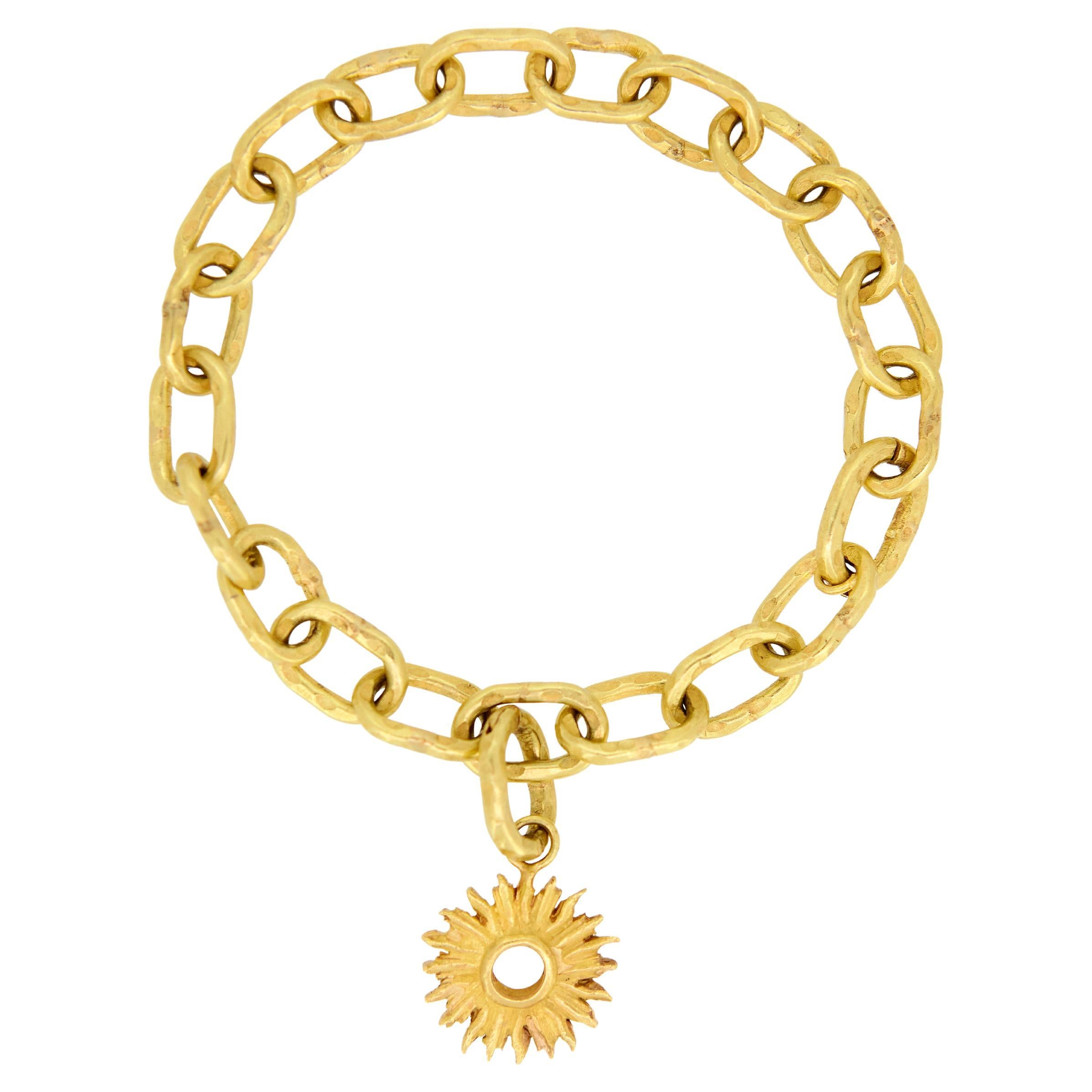 18kt Gold Link Charm Bracelet with a Sunburst Charm