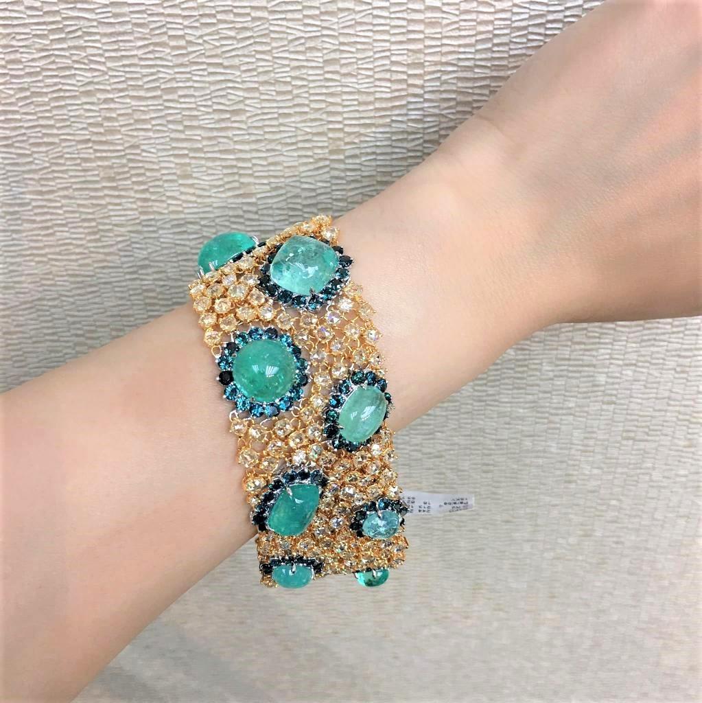 The Following Item we are Offering is this Magnificent 18KT Gold Large Extremely Rare Paraiba and Fancy Yellow Diamond Blue Sapphire Bracelet. This Gorgeous Bracelet features Large Gorgeous Paraibas set in Fance Yellow Diamonds and surrounded with