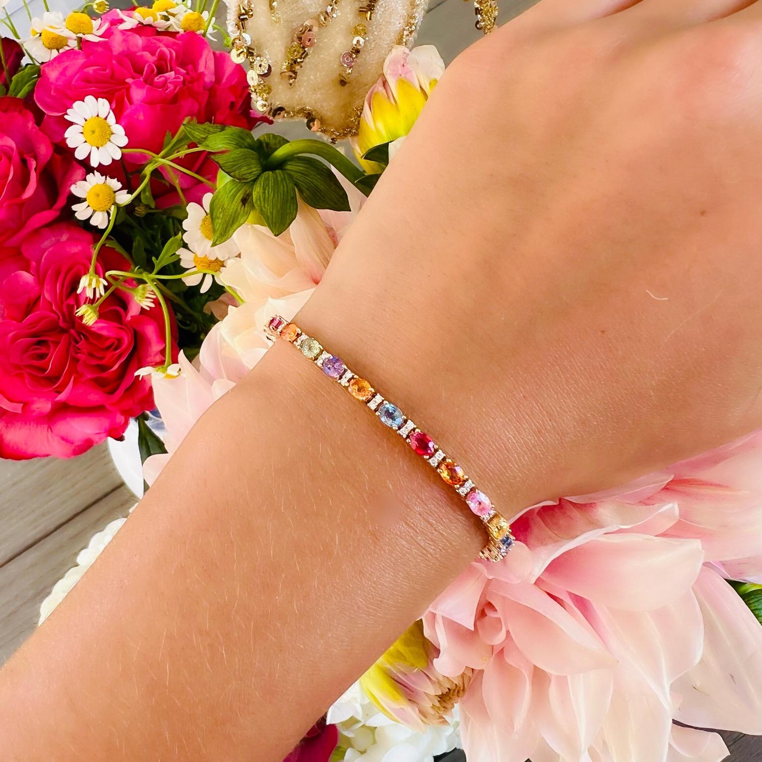 The perfect pop of color you've been looking for! This 18 karat gold bracelet features 6.31 carats of fine multi-colored vibrant sapphires with 0.34 carats of sparkling white melee diamonds expertly set alongside the colored stones for additional