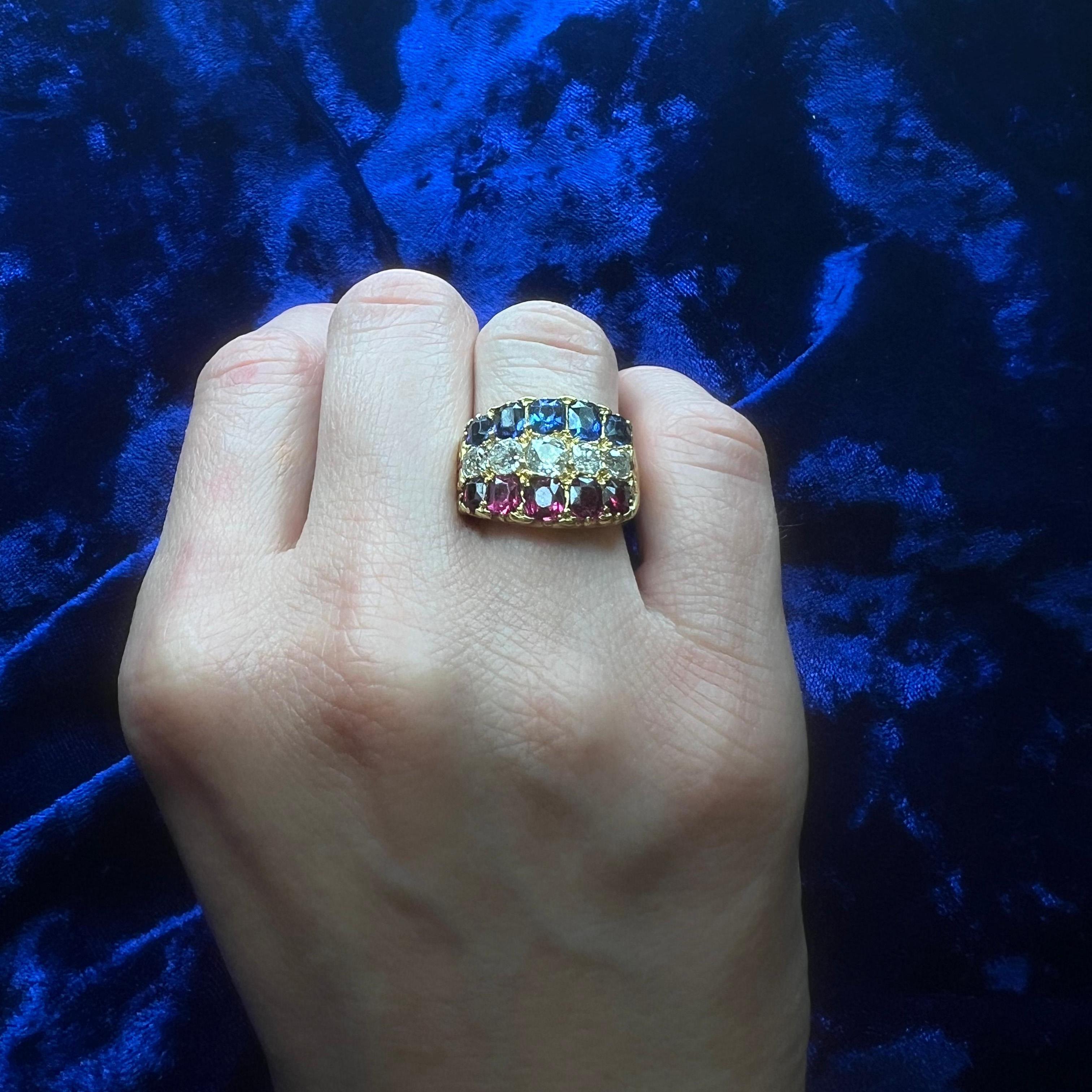 18kt gold 1.30 cts. Ruby, 1.28 ct. Sapphire, and 1.00 ct. Old Mine-Cut Diamond Ring.

A beautifully crafted 18kt yellow gold ring, set with an elegant combination of five oval mixed-cut natural rubies, five oval mixed-cut natural sapphires, and five
