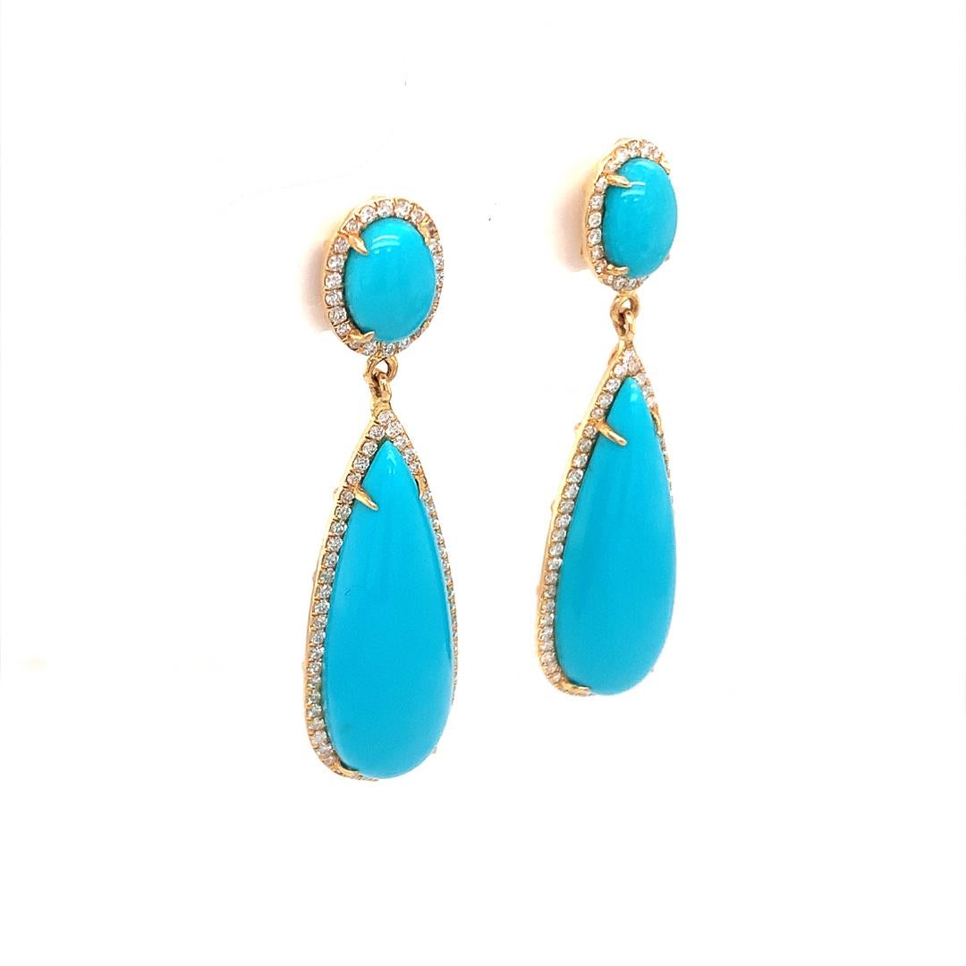 Earrings set in 18 carat yellow gold with a 0.55-carat VS quality diamond surrounding a 12.93-carat round and pear-shaped natural turquoise.
 