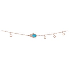 18kt gold necklace with diamond 
turquoise hand and dangling rose-cut diamonds