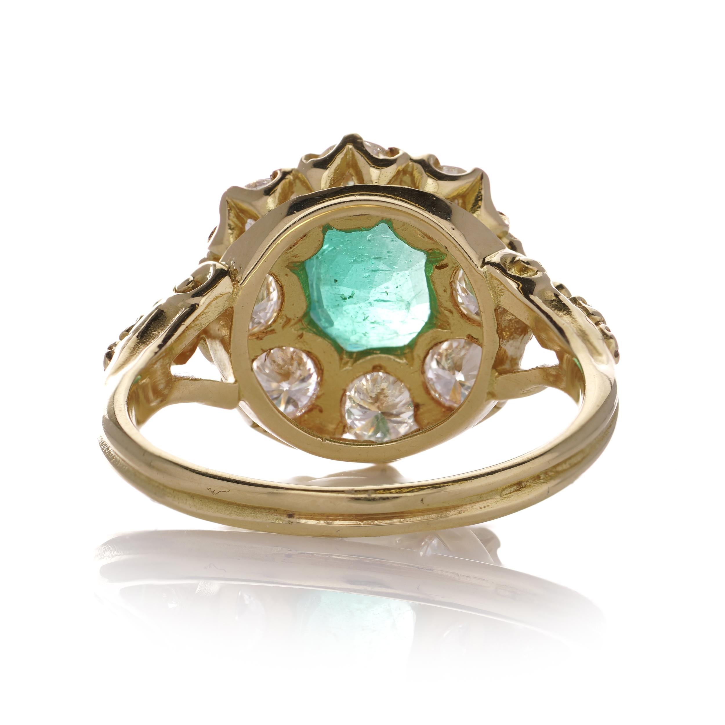 Oval Cut 18kt. gold Oval 1.10 carats of emerald Cluster ladies ring with diamonds  For Sale