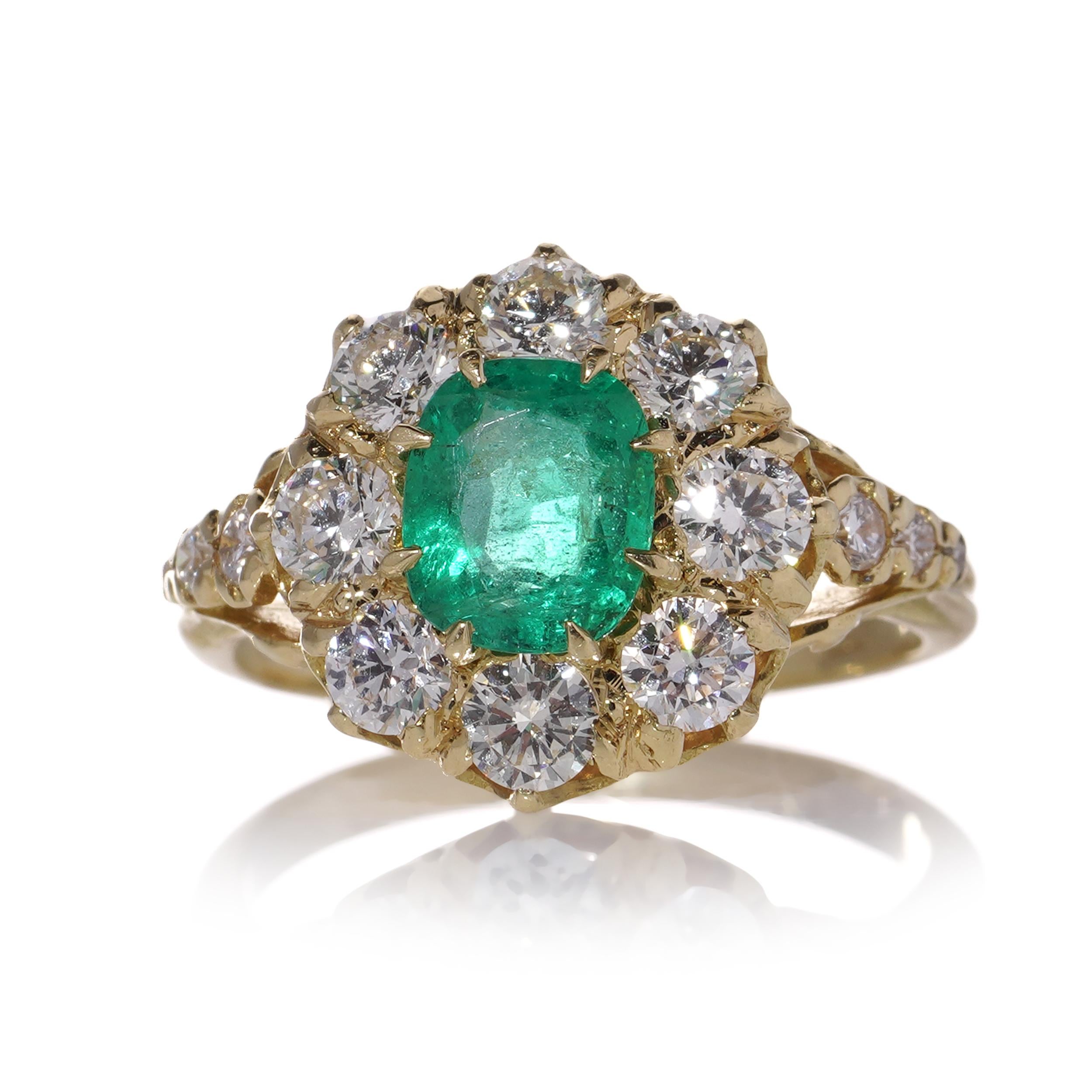 Women's 18kt. gold Oval 1.10 carats of emerald Cluster ladies ring with diamonds  For Sale
