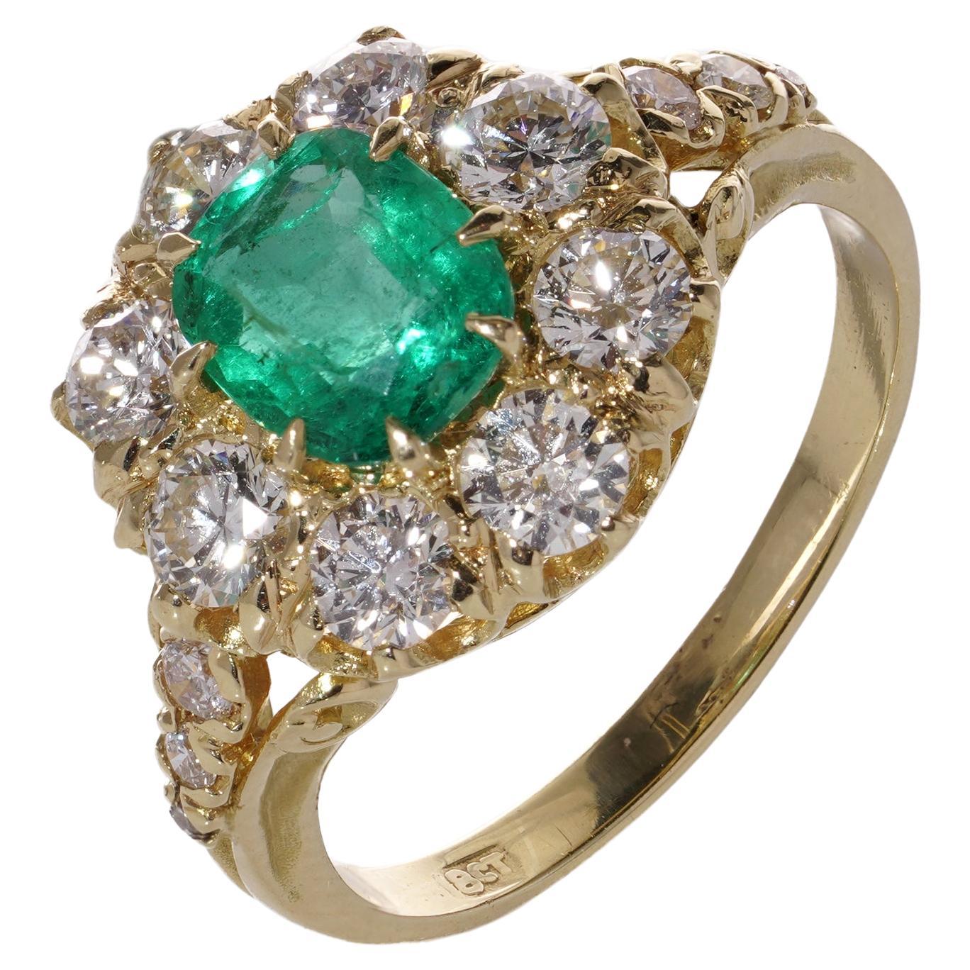 18kt. gold Oval 1.10 carats of emerald Cluster ladies ring with diamonds  For Sale