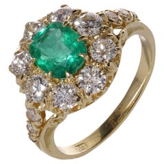 18kt. gold Oval 1.10 carats of emerald Cluster ladies ring with diamonds 