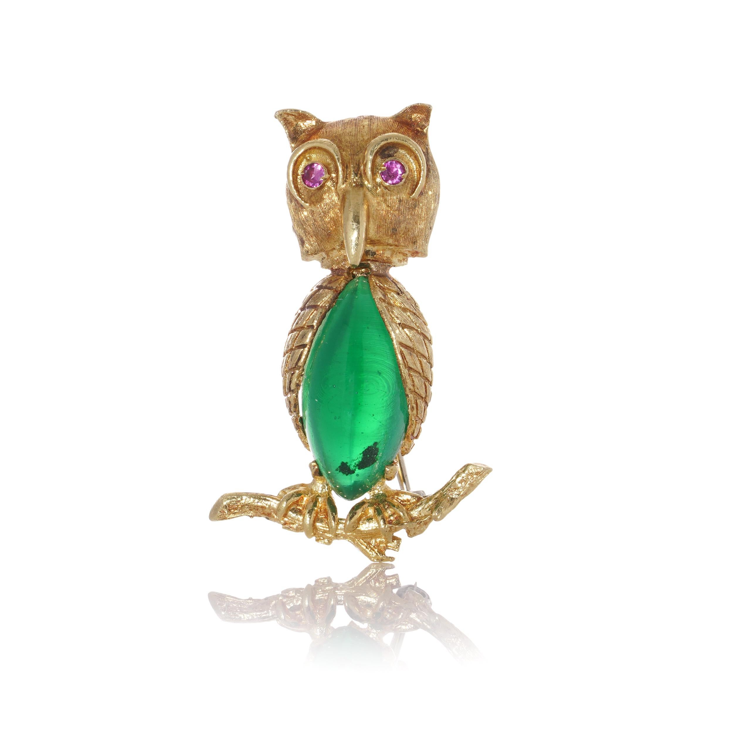 Mid-20th-century 18kt gold owl brooch standing on a branch, the body is set with coloured glass, and the eyes are set with rubies. 
Made in Europe mid-20th century.
Hallmarked 18KT Gold and 521A 

Dimensions -
Size: 3.5 x 2.3 x 1 cm 
Weight: 8.8