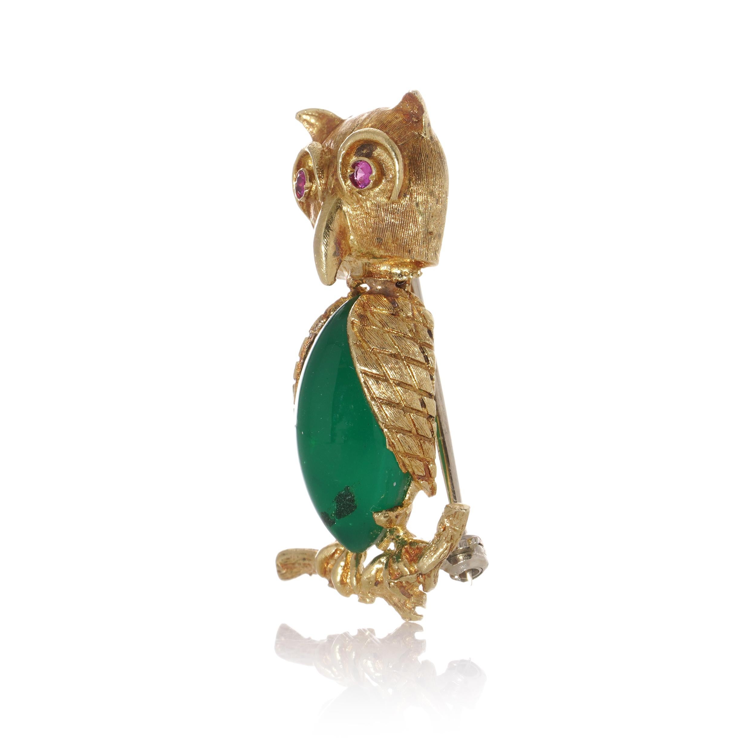 Round Cut 18kt gold owl brooch standing on a branch with coloured glass body and ruby eyes For Sale