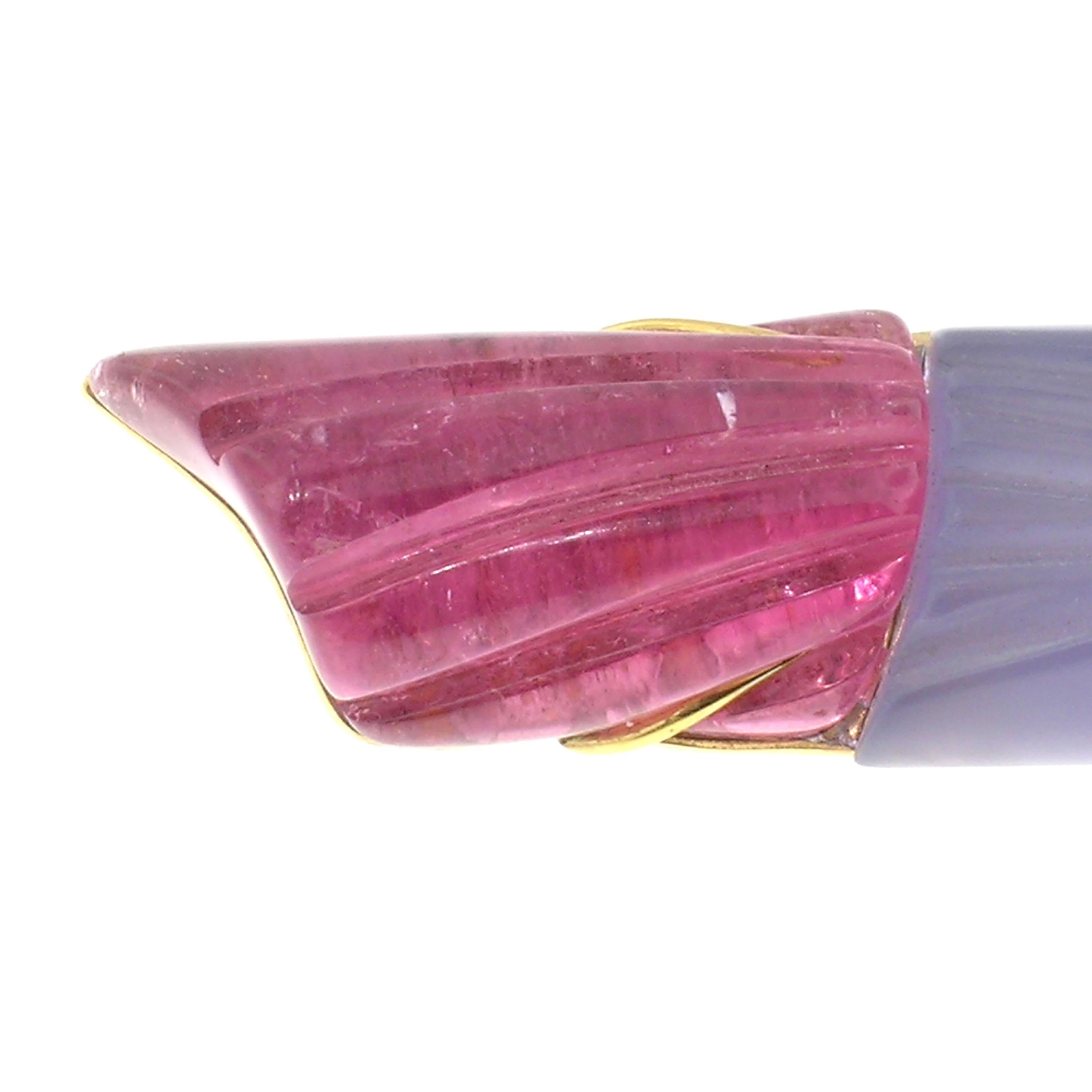 This elegantly carved torch is an exquisite signature piece of jewelry. The chalcedony carving is perfectly married to this pink tourmaline carving; both are by Steve Walters. This 18kt piece of jewelry is perfectly made to enhance rather than