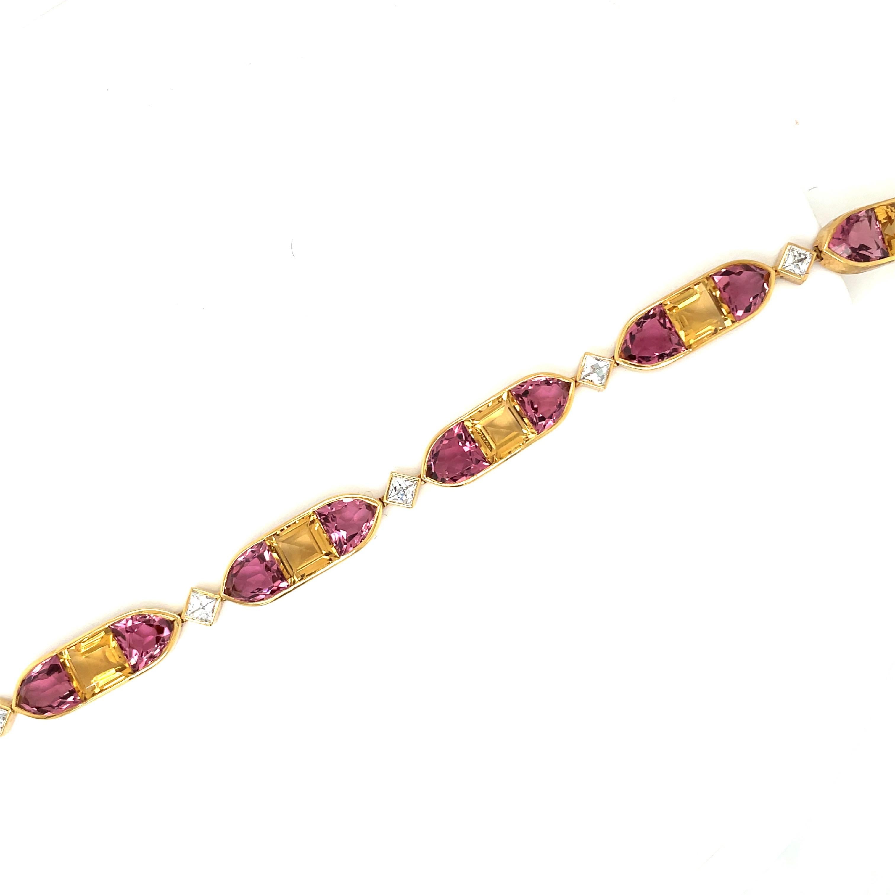 This lovely 18kt gold bracelet is made up of 6 sections featuring a square cut citrine flanked by pink tourmalines. Each section is connected with a beautiful white french cut diamond.
Totaling 42cts of tourmaline and 2.40 cts of diamonds.
The