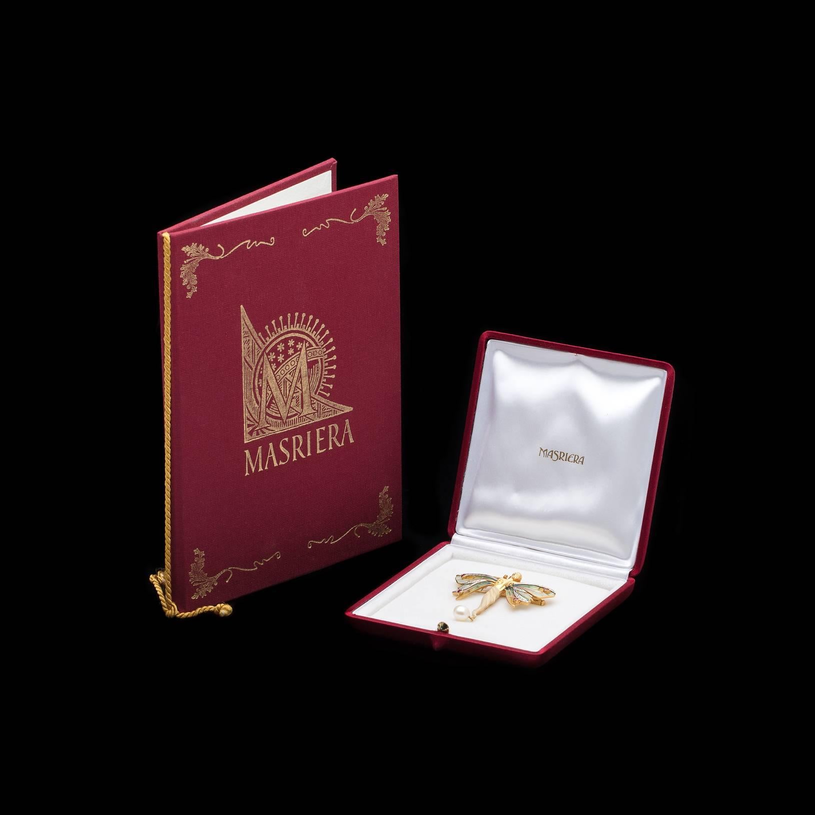 From Spain's master of Art Nouveau jewelry, Luis Masriera, comes this lovely 18 karat Yellow Gold, Diamond, Ruby Enamel and Pearl Pendant/Brooch with its original box and certificate of authenticity. The exceptionally intricate enamel work