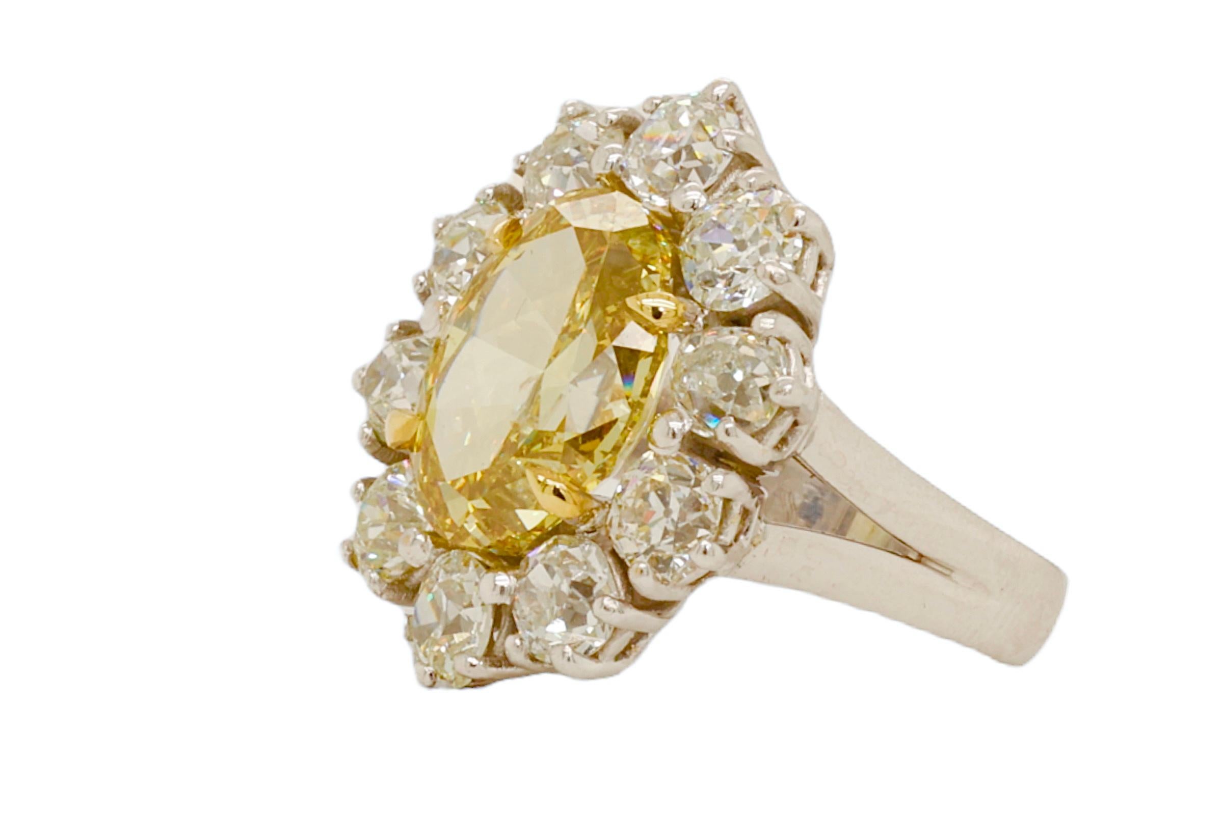 Artisan 18kt Gold Ring 7.17ct Natural Fancy Yellow Oval Diamond & 4.5ct White Diamonds For Sale