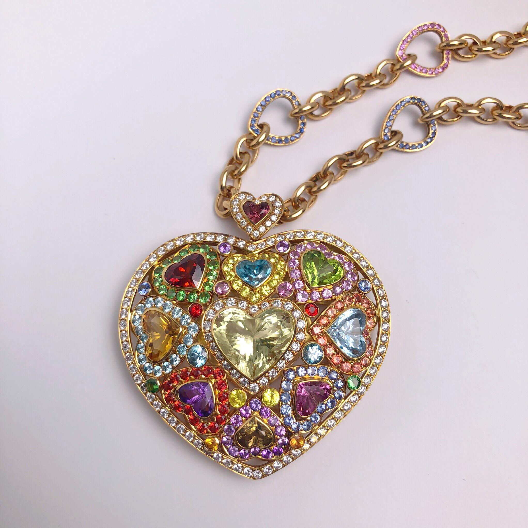 Charming and Colorful this rose gold pendant necklace has been set with 10 semi precious hearts , each outlined with fancy colored sapphires and white diamonds. The 2