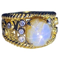 A Star Sapphire & Diamond Ring set in 18kt Yellow Gold 