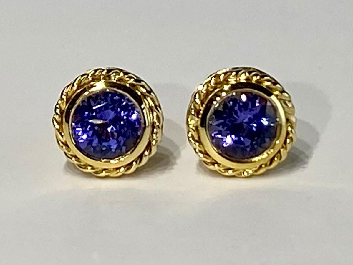 Kary Adam Designed, 18kt Gold Tanzanite Stud Earrings. Tanzanites are very deep blue set in a rope style setting.

Originally from San Diego, California, Kary Adam lived in the “Gem Capital of the World” - Bangkok, Thailand, sourcing local gem