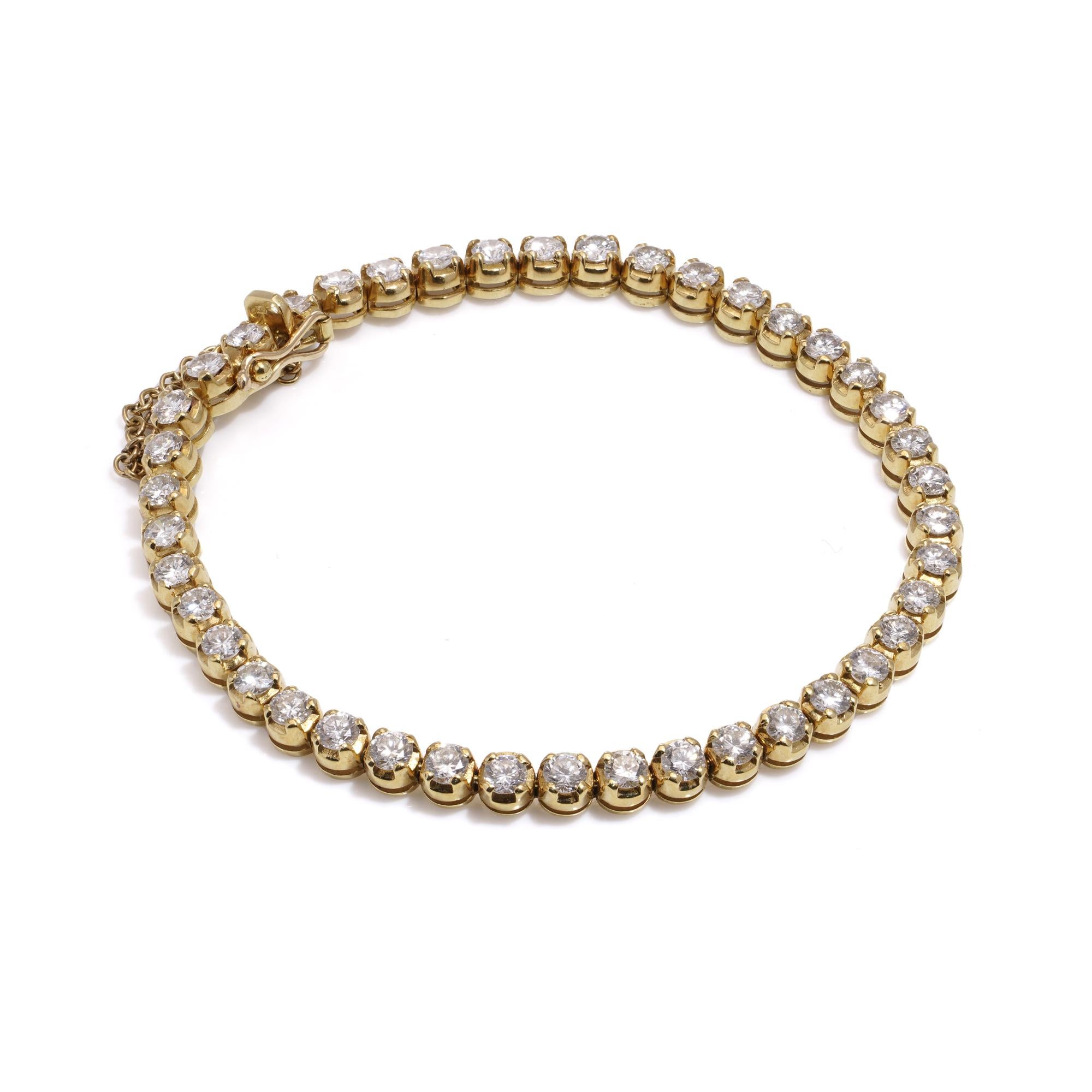 18kt yellow gold tennis bracelet set with 6.30 carats of round brilliant diamonds. 
Hallmarked with 750 mark, maker's mark. 
Made after 2000s 

Dimensions:
Bracelet size: L 
Weight: 16.00 grams

Diamonds - 
Cut: Round brilliant 
Quantity of stones: