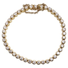 18kt gold tennis bracelet set with 6.30 carats of round brilliant diamonds 