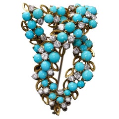 Broche de oro de 18 quilates con turquesas y diamantes