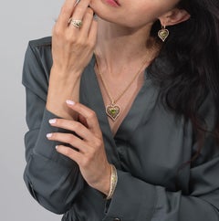 18kt. Heart on a chain with color heart shaped stone & approx. 0.71ct diamonds