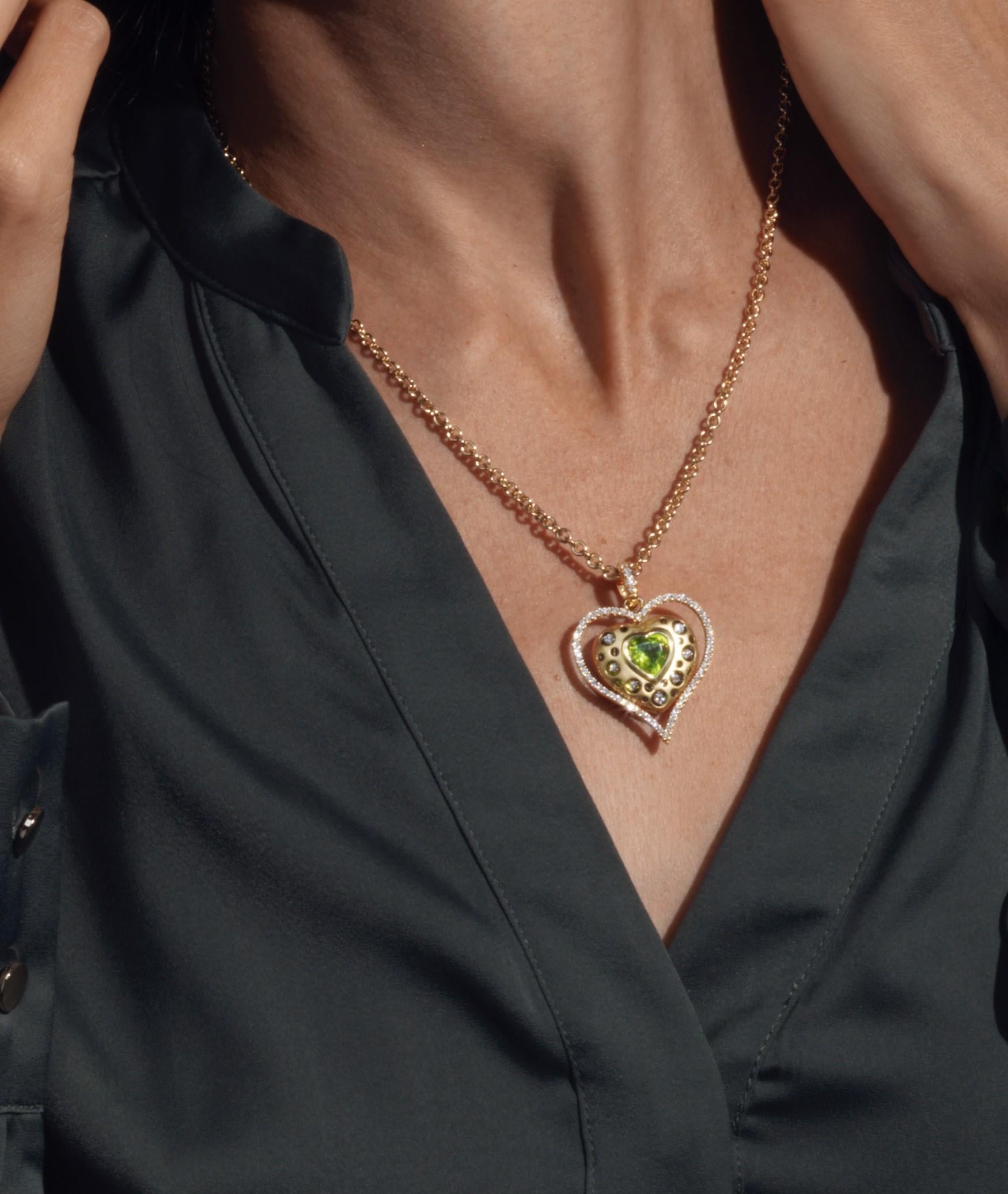 Contemporary 18kt. Heart on a chain with color heart shaped stone & approx. 0.71ct diamonds For Sale