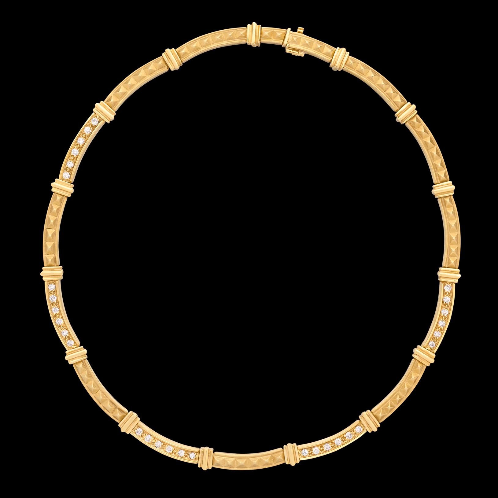 Modern design meets high fashion and wearability. This 18 karat gold Italian beauty features a modern textured design highlighting 30 fine white diamonds for 1.35 carats total weight (averaging G-H/VS). The choker necklace weighs 58 grams, measures