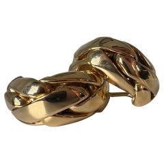 Pendientes Omega de lujo de 18 quilates huggies