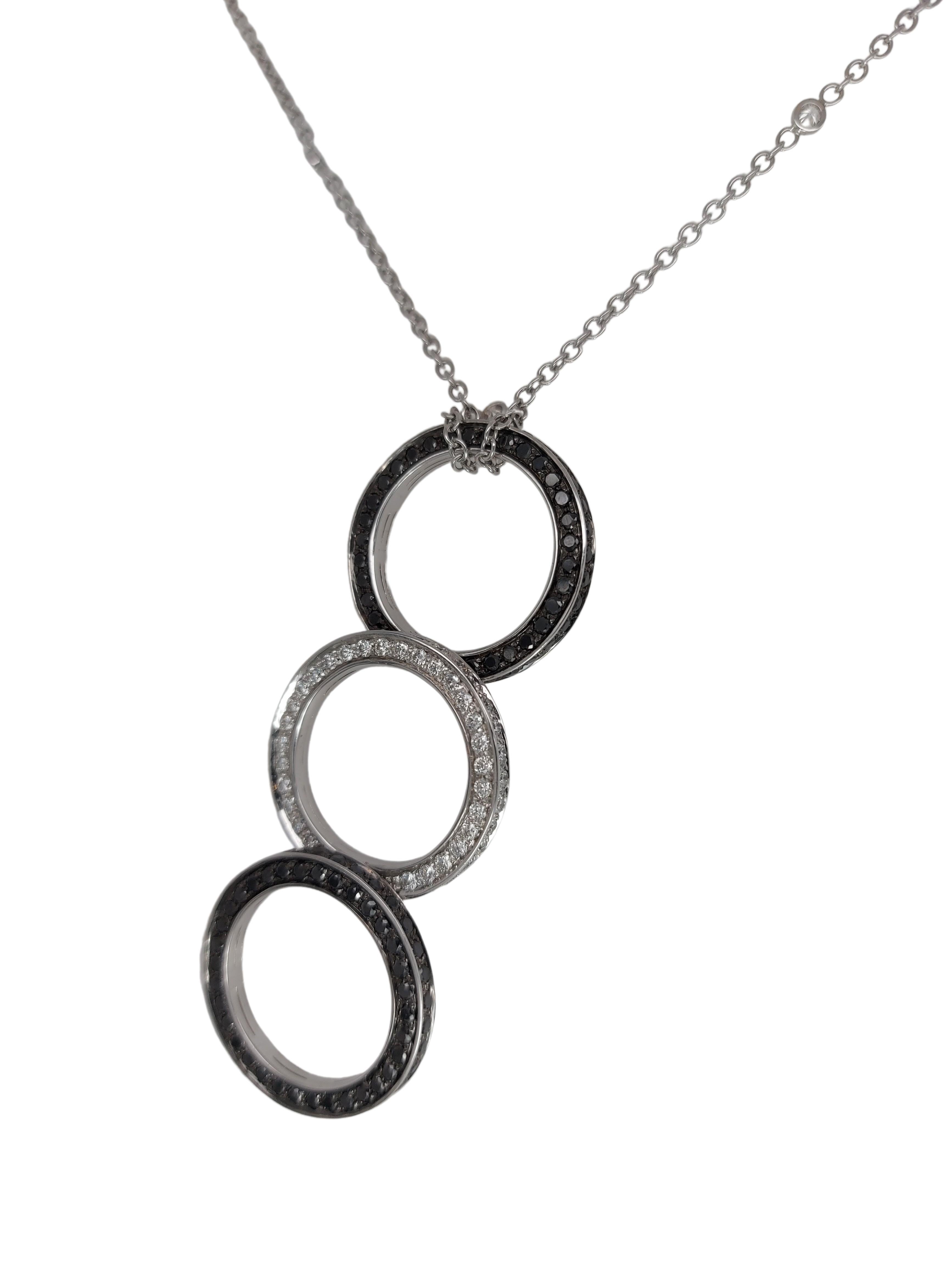 Very Unique and Special Necklace Pendant with Black and White Diamonds, Can be Transformed into a Triple Ring! 

Comes with a gorgeous 18kt white gold chain with 6 little diamonds 

Diamonds: Black diamonds and Brilliant cut white diamonds (all