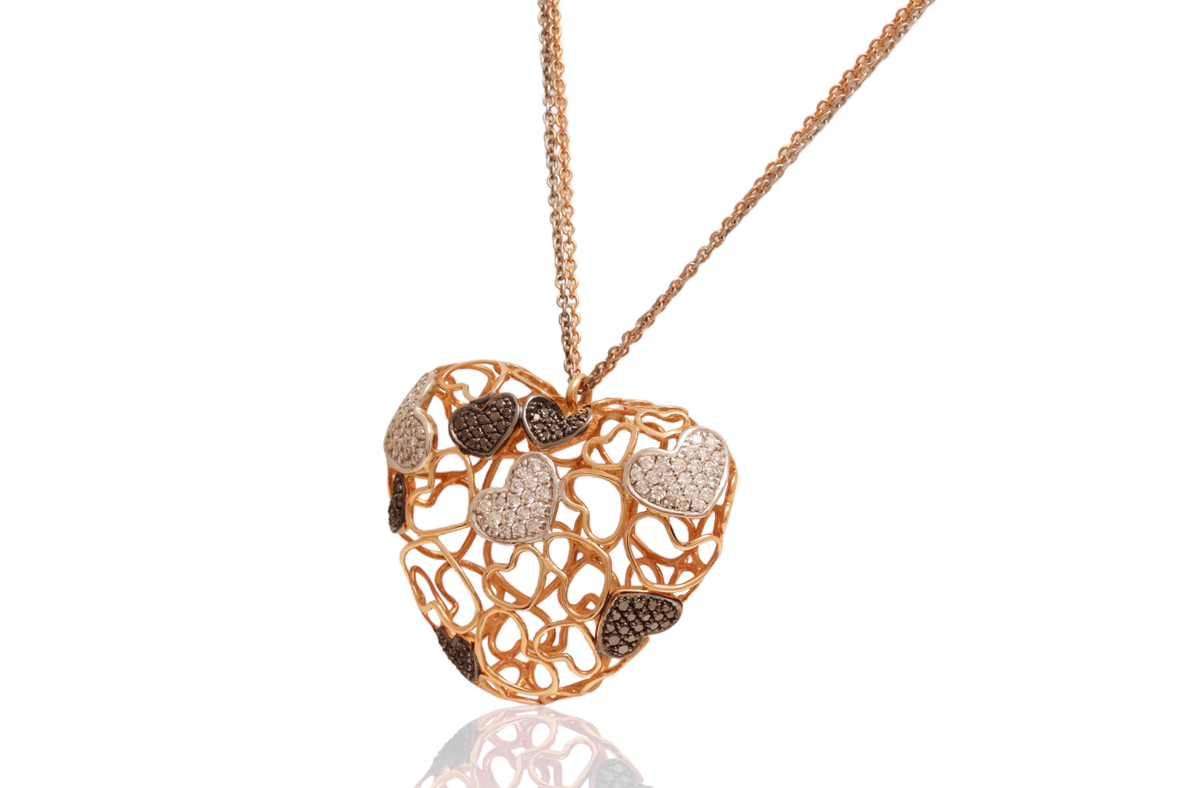 Pink gold heartshaped necklace set with black and white diamonds.
Diamonds: White brilliant cut diamonds together ca. 1.34 Cts, black diamonds together ca. 0.84 Cts
Material: 18 kt pink gold
Measurements: 45 mm x 38 mm
Weight: 23.8 gram / 15.3 dwt /