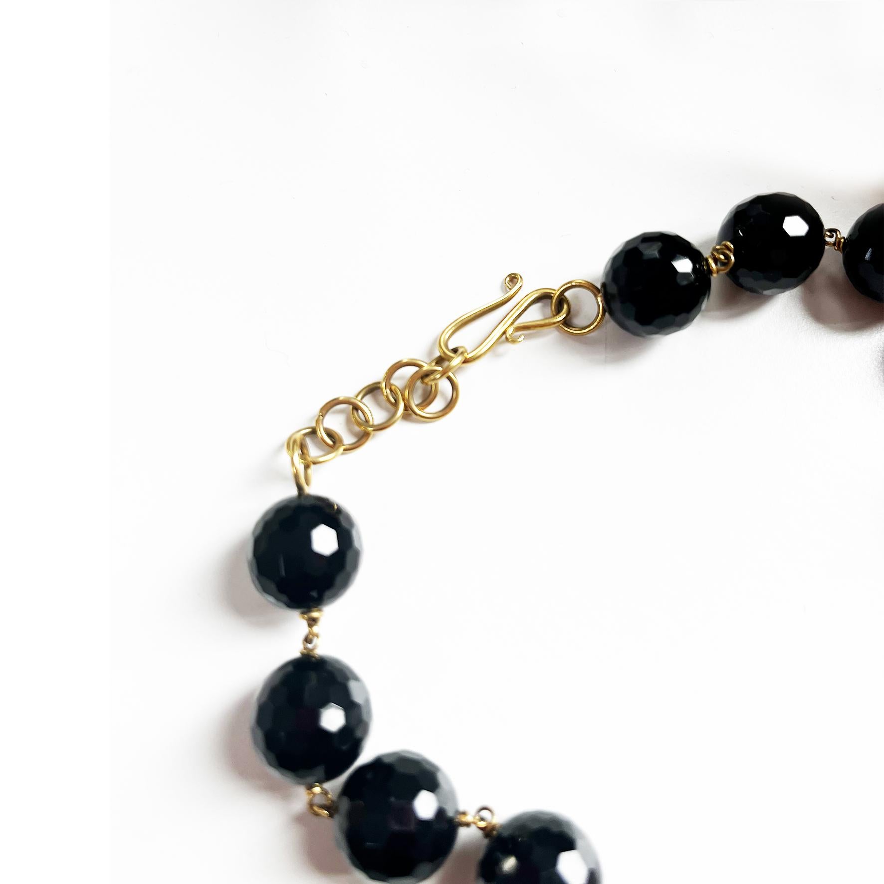 This 18KT pink gold necklace with black Onyx faceted beads and citrine & pearls pendants is a beautifully designed piece. The 4 pendants create a visually stunning and unique necklace giving a touch of light to the neck in contrast with the black