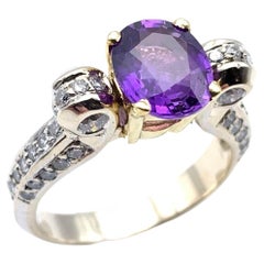 Anello con zaffiro viola e diamante 18KT