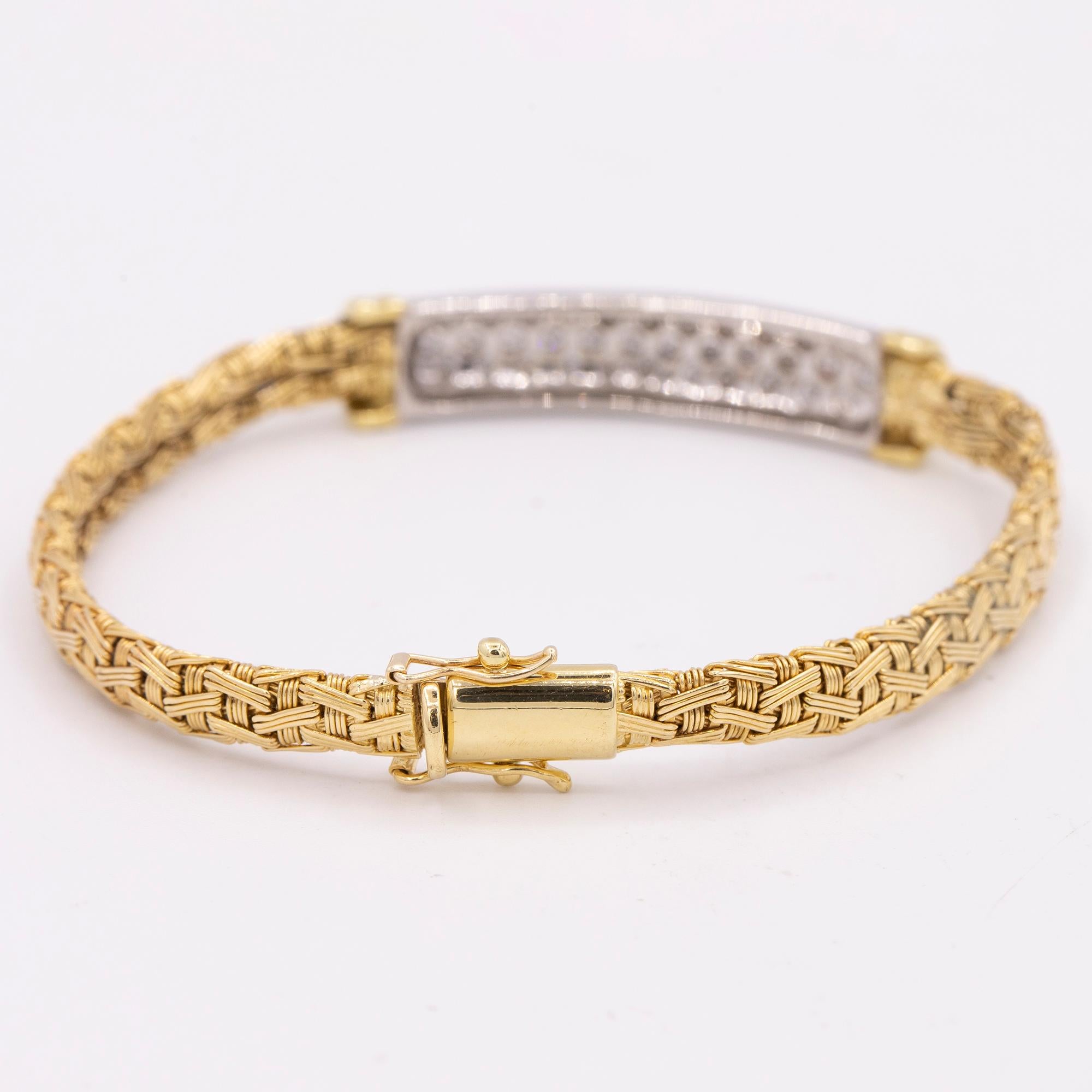 Vintage 18kt Yellow Gold bracelet featuring 34 round brilliant diamonds weighing approximately 1.00 carats in total weight. The diamonds are G - H in color & SI in clarity. The bracelet has a woven yellow gold bracelet with diamonds set in the