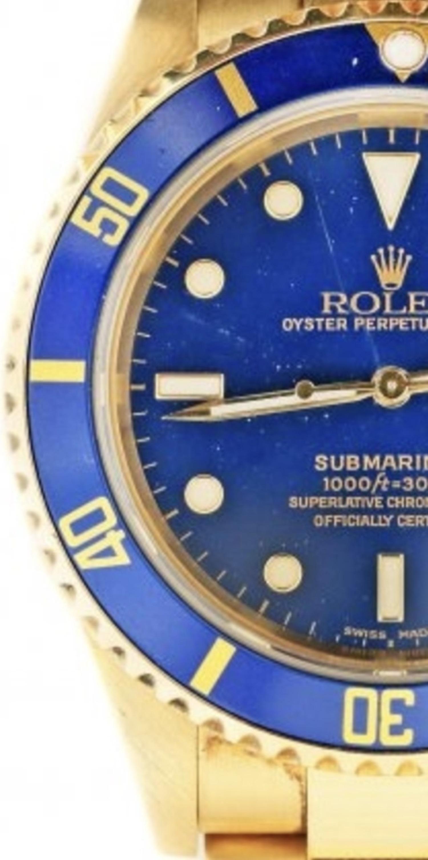 
18KT Rolex Oyster Perpetual Submariner Wristwatch 
Swiss, automatic mechanical movementwith date. Blue dial inscribed Submariner, 1000ft=300m. The blue rotating outer bezel calibrated for minutes. Case, dial and movement signed Rolex. Bracelet