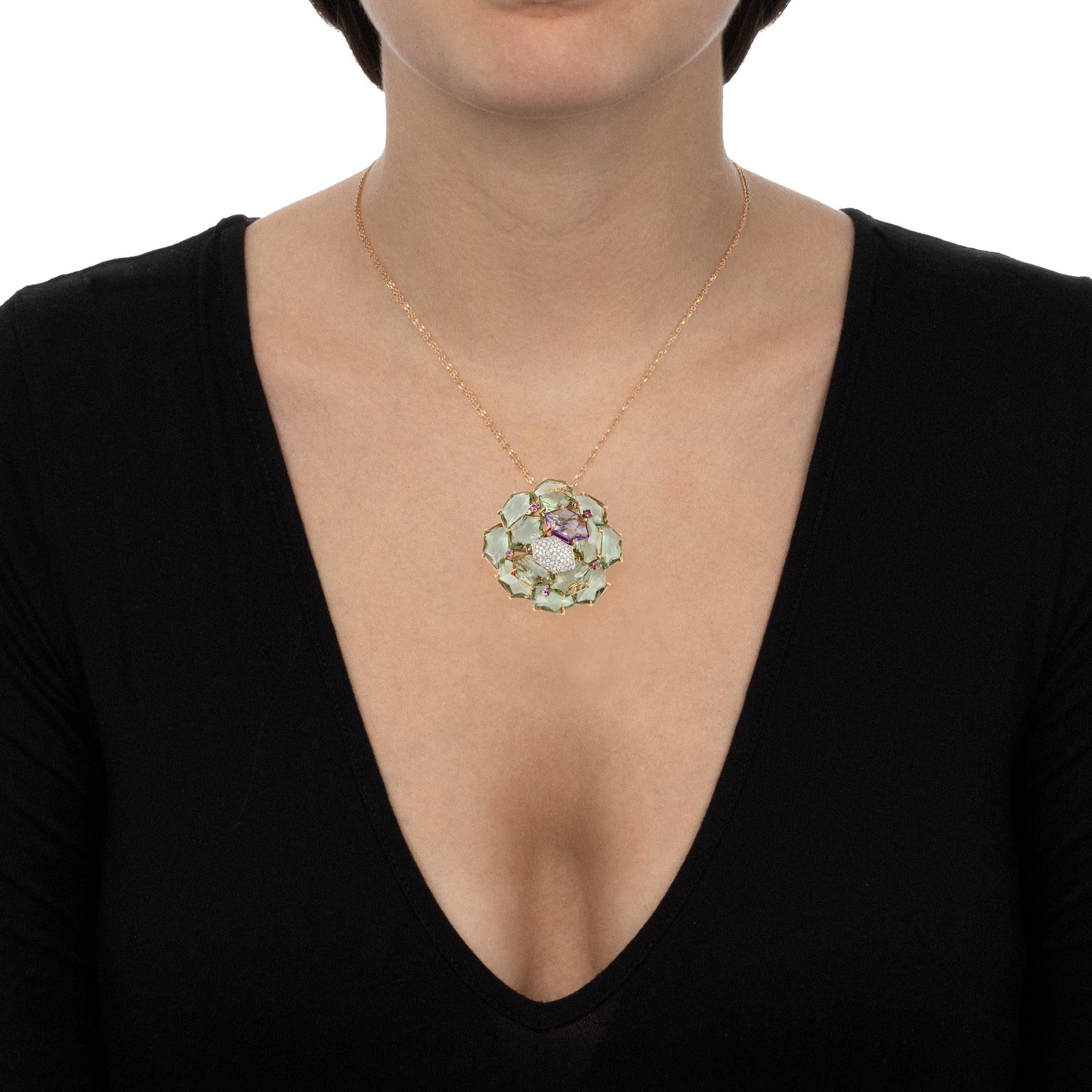 A handmade contemporary jewellery piece with a modern design that is bold and sophisticated at the same time. The distinctive asymmetrical setting of the pendant lets the gemstones sparkle bright, drawing the light around your neckline with the warm