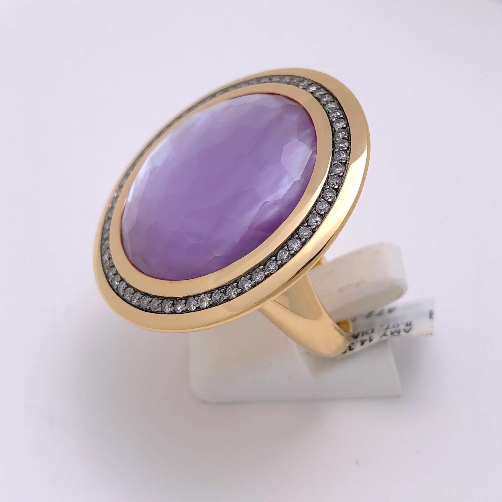 The 14.35 carat faceted cabochon amethyst is backed by an 8.07 carat natural mother of pearl, giving the amethyst its unusual yet stunning luster. The amethyst is set in 18 karat rose gold with a 0.57 carats of diamonds set in blackened gold, adding