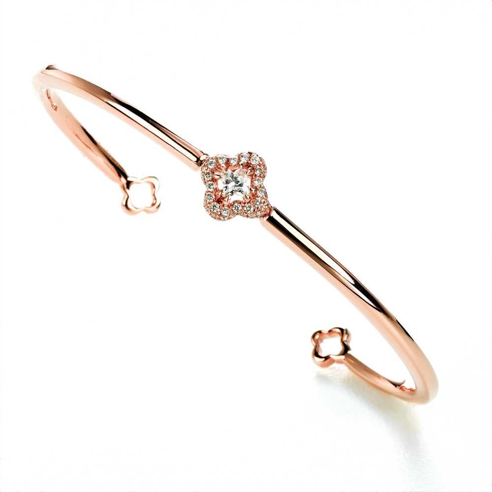 18KT rose gold 2 1/4 inch diameter diamond flower bangle.  .1 LILY CUT ® flower shape diamond H color VS SI clarity  0.18cts . additional 0.19 ct round diamond accent . solid gold  8.8 grams.