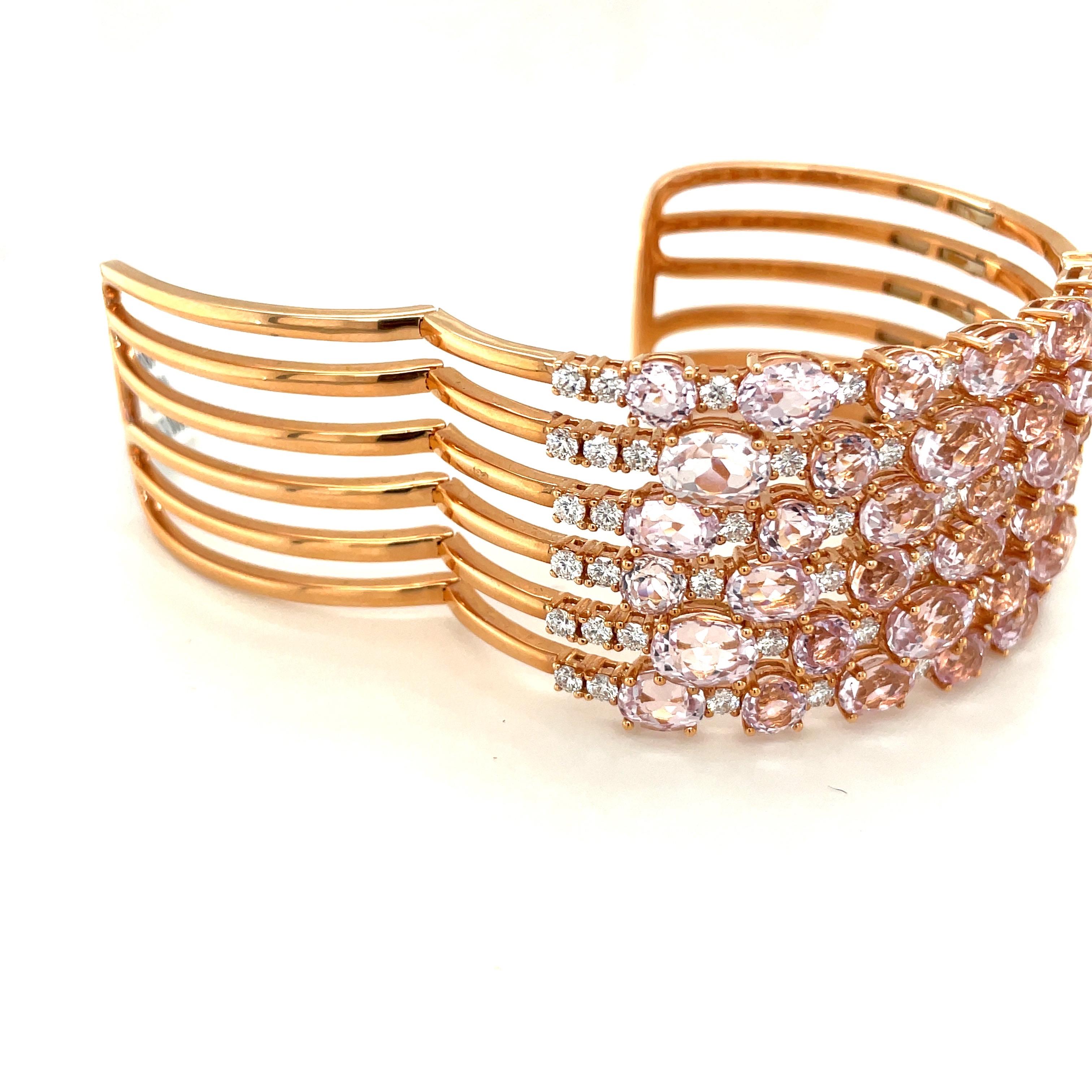 This 18 karat rose gold cuff bracelet is designed with 34 oval and round kunzite stones weighing 35.28 carats. Round white brilliant diamonds 3.70 carats, alternate with the kunzites. The stones are set on 6 rose gold sections of this 1.25