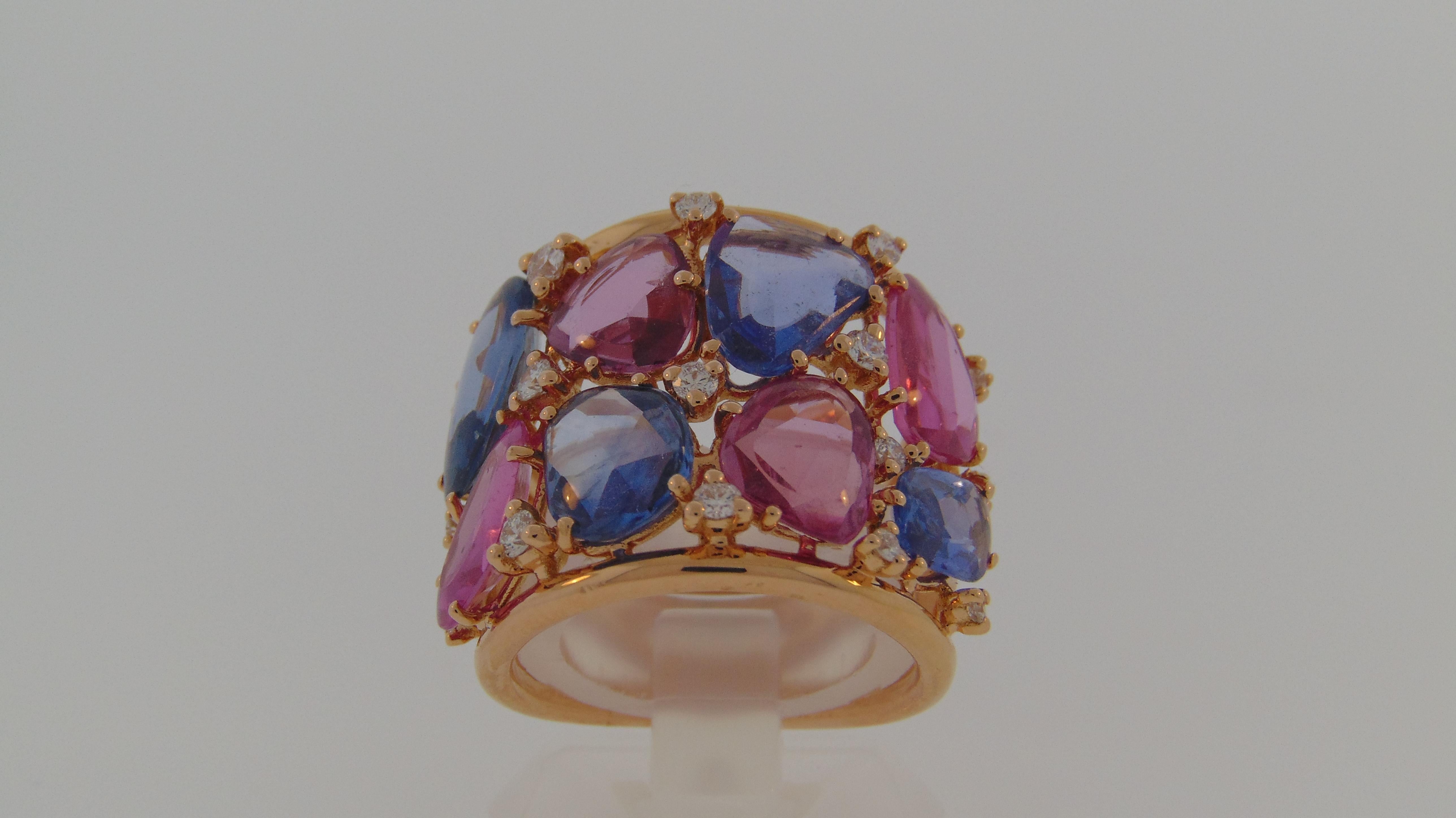 A Beautiful Modern Ring with 8 Rose cut freeform Sapphires in blue and pink hues totaling 10.40 Carats with .48 carats of Diamonds in between, all set on 18Kt Rose Gold. 