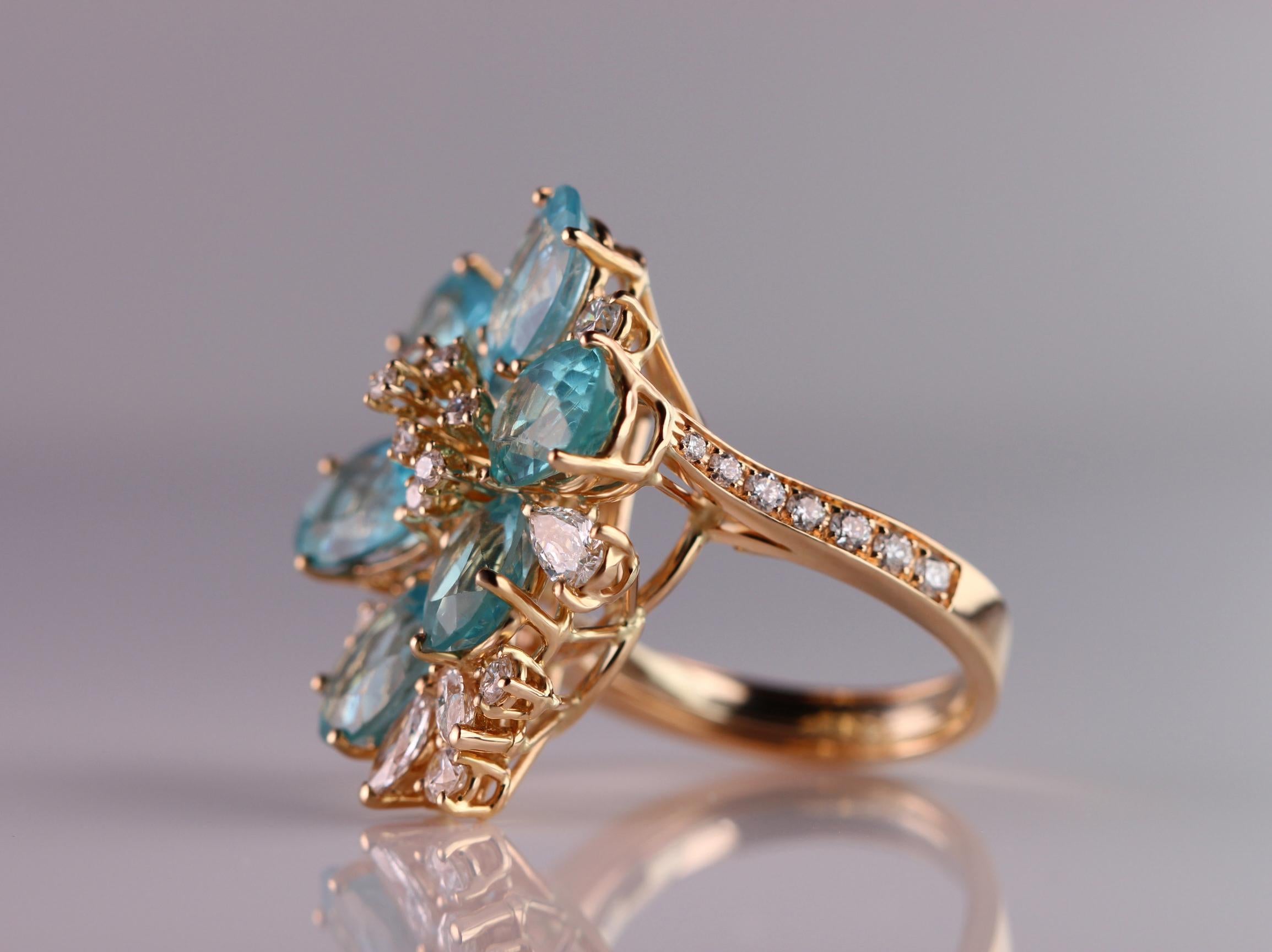 Oval Cut Alluring 18kt Rose Gold Cocktail Ring with Oval Blue Apatites and Diamonds For Sale