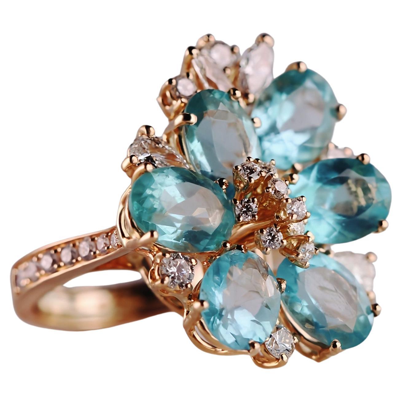 Alluring 18kt Rose Gold Cocktail Ring with Oval Blue Apatites and Diamonds For Sale