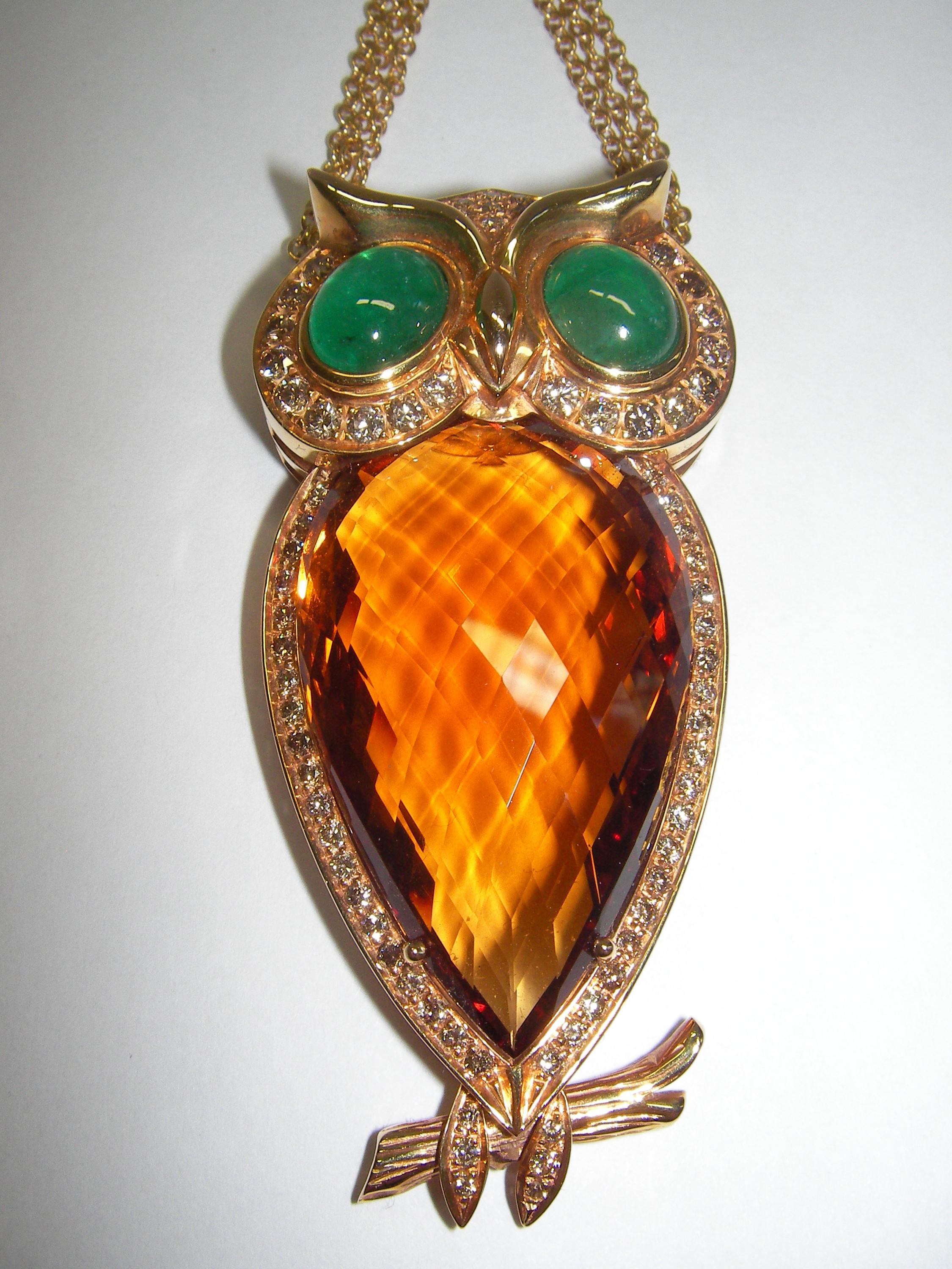 Offered here is a truly unique 18 karat rosé gold Owl shaped pendant set. Elegant Cognac colored Diamonds and vibrant Emeralds enhance the exquisite center Citrine palm stone measuring almost 75 Carat. The delicate anchor link chain compliments this