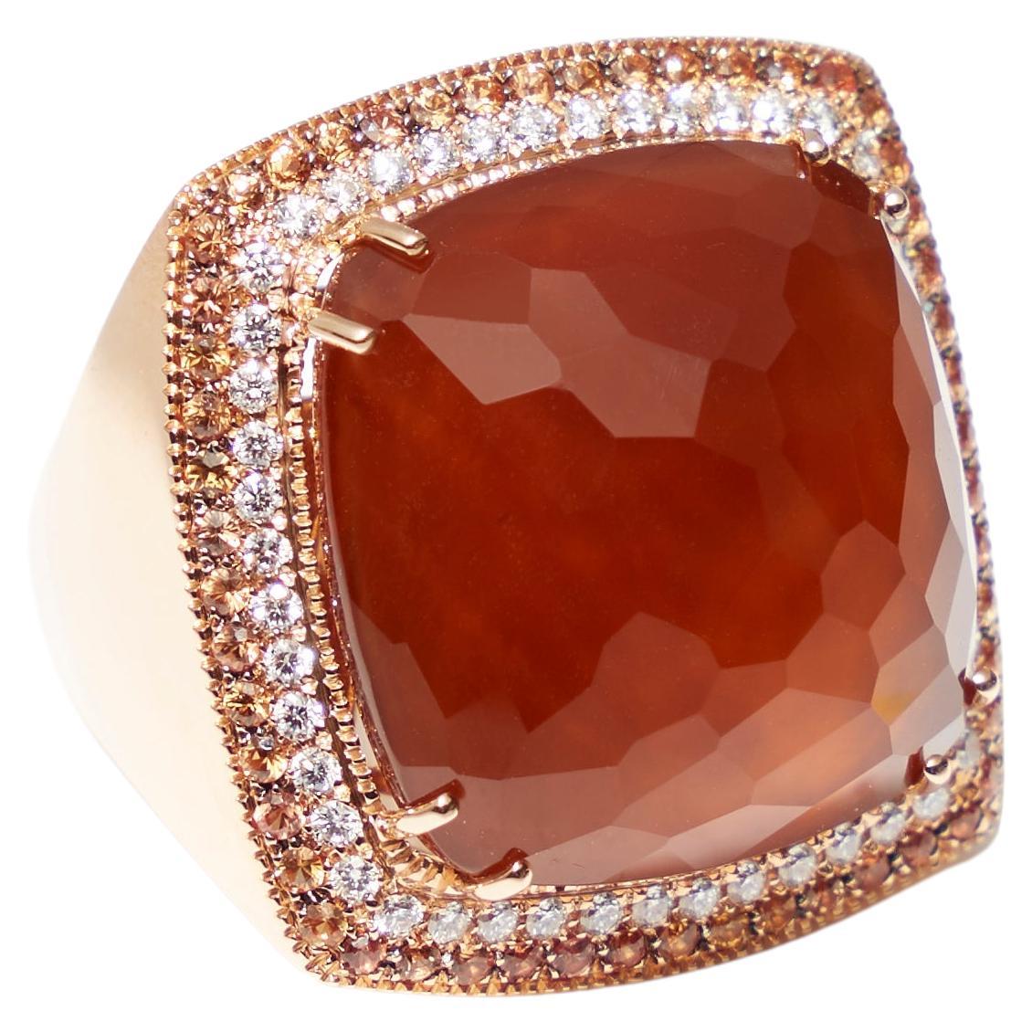 18 karat rose gold ring with layered smokey quartz, agate and mother of pearl as a center stone, set with 0.71 carat orange sapphires and 0.51ct diamonds.

Made in Italy and by craftsman that create jewelry that is modern, sophisticated, and bold.