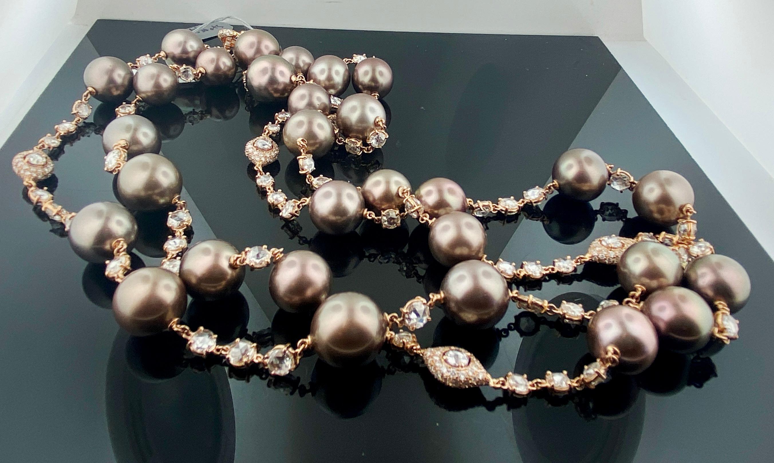 Set in 18 karat rose gold are 25 Brown South Sea Pearls with 26.51 carats of Rose Cut diamonds and 3.33 carats of full cut diamonds.  Necklace is 46