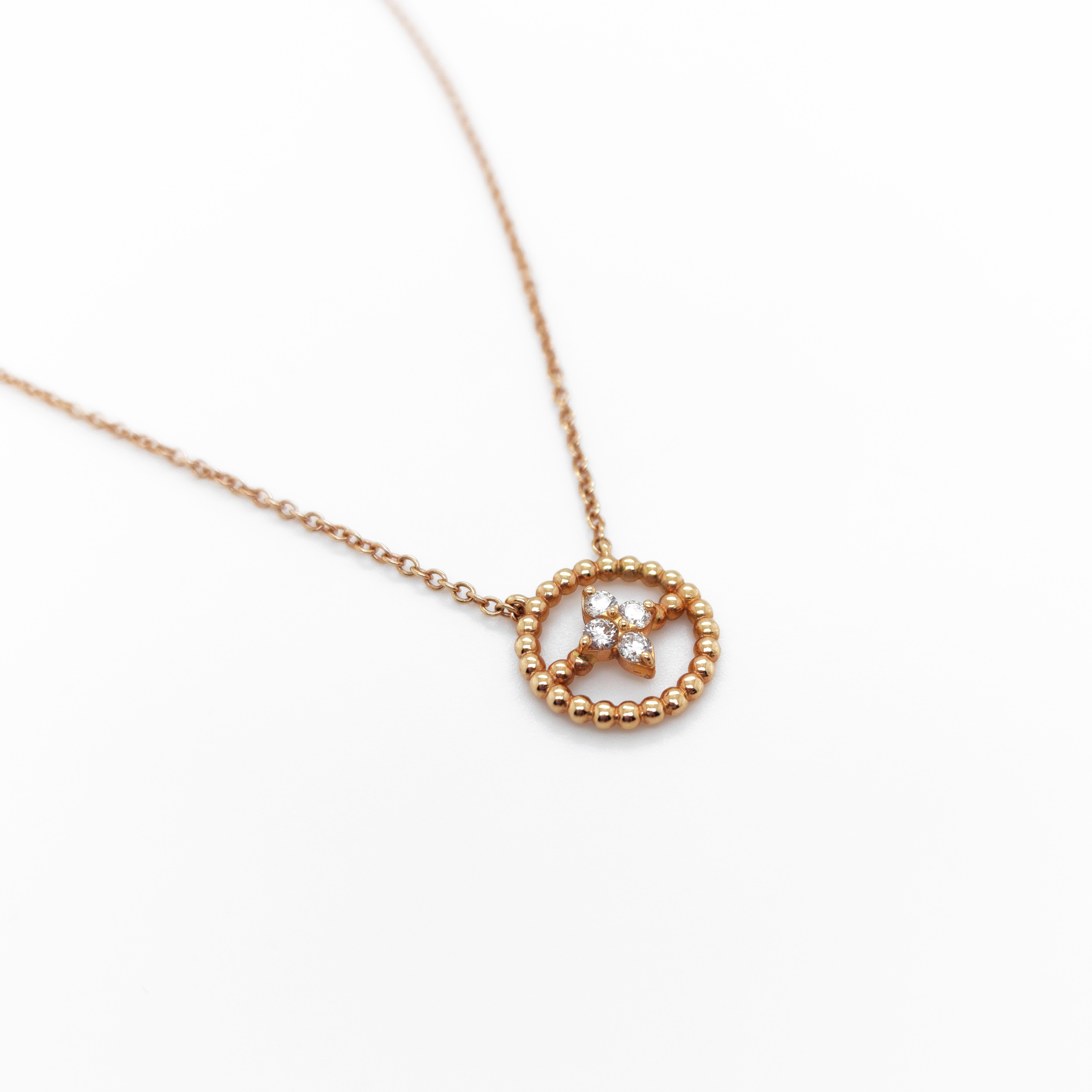 This 18KT rose gold & diamonds round necklace is easily worn everyday as it is light and sparkly! 
The circle gold ball design includes a diamond motif of 0,13 cts G-VS natural white diamonds.
This addition of diamonds to the necklace further